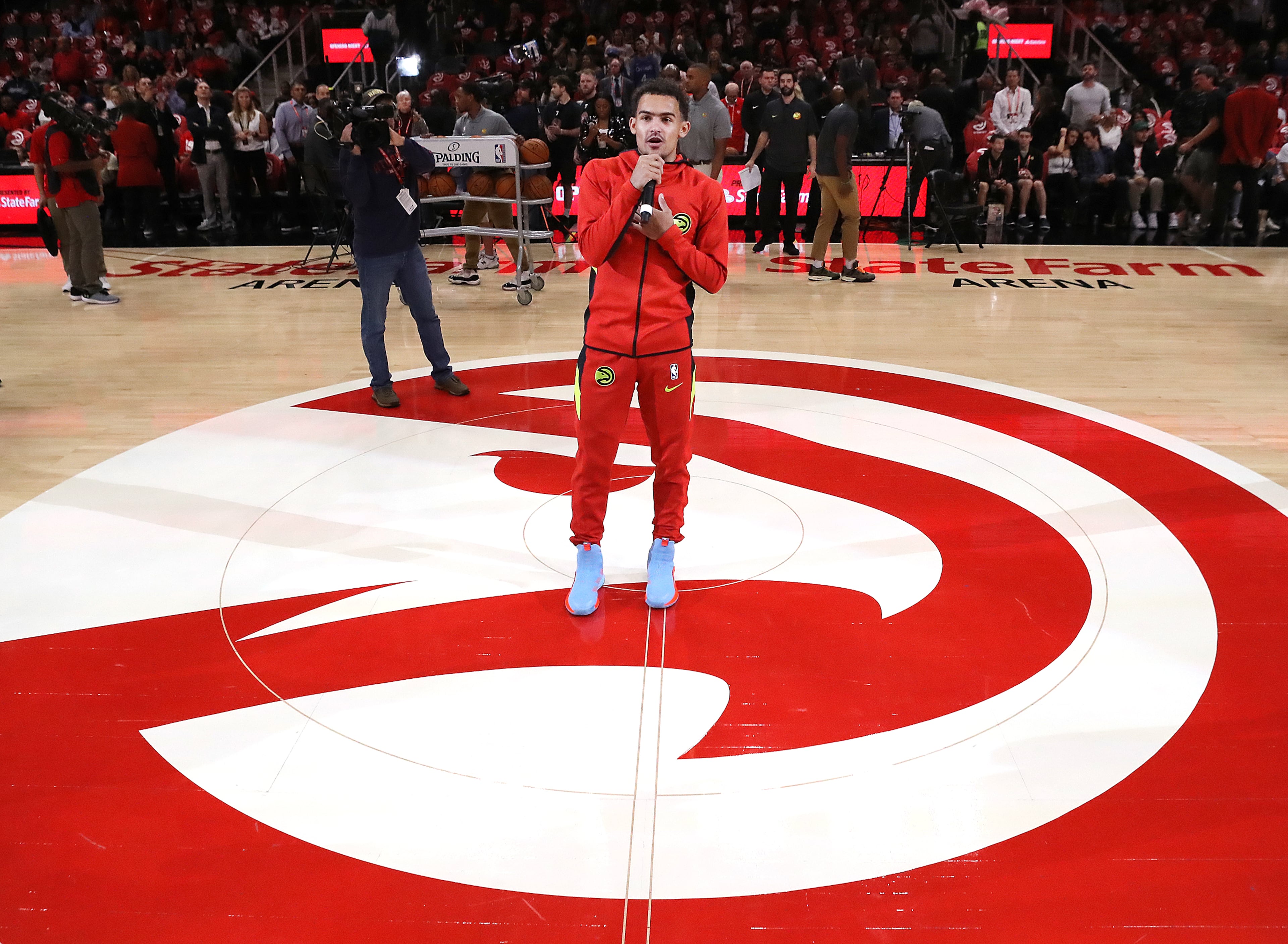 Hawks guard Trae Young welcomes fans to State Farm Arena for the home opener against the Orlando Magic in a NBA basketball game on Saturday, October 26, 2019, in Atlanta. Curtis Compton/ccompton@ajc.com
