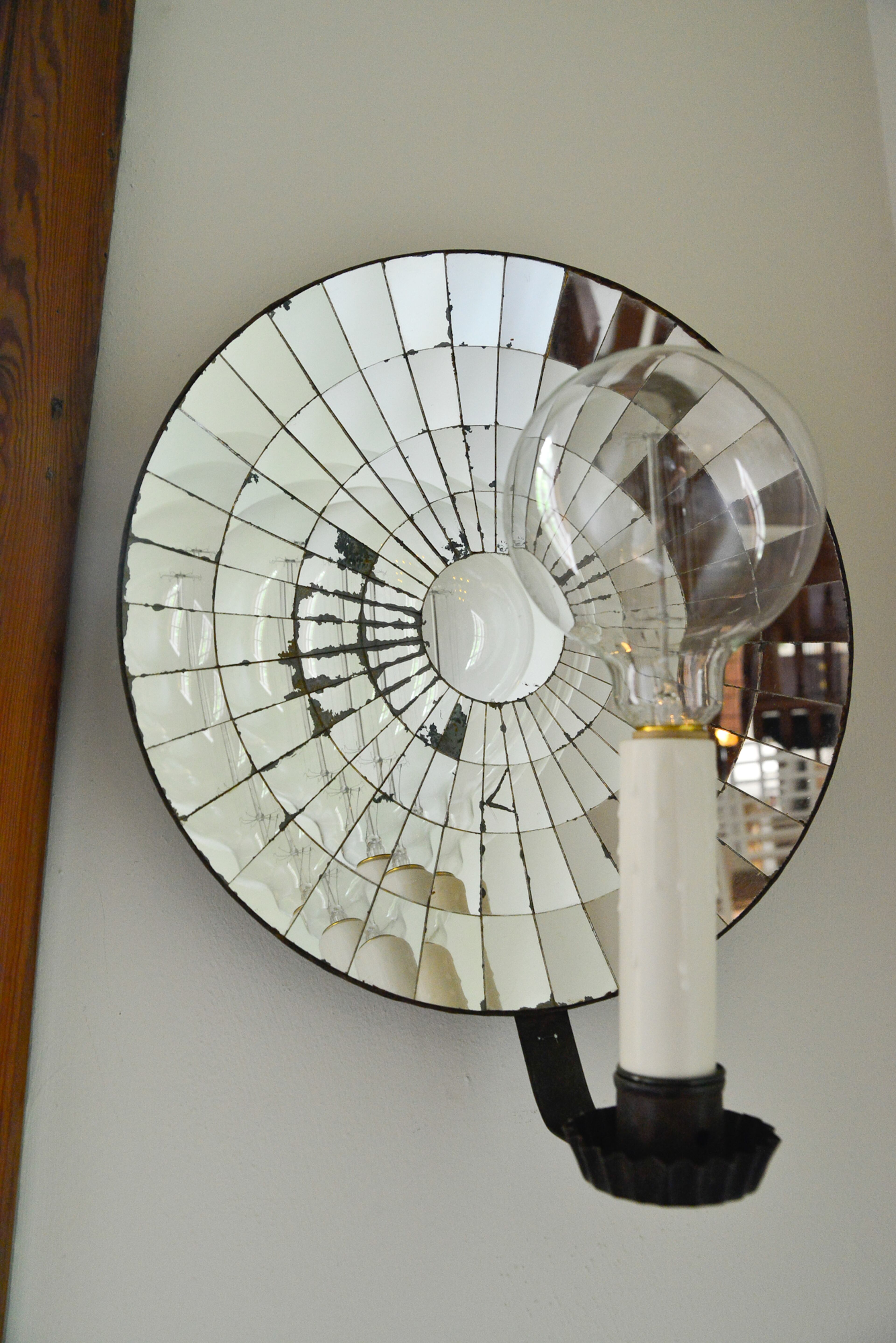 In the stairwell, Elliott Niespodziani modified two candleholders, which she found at Scott Antique Market, into light fixtures.