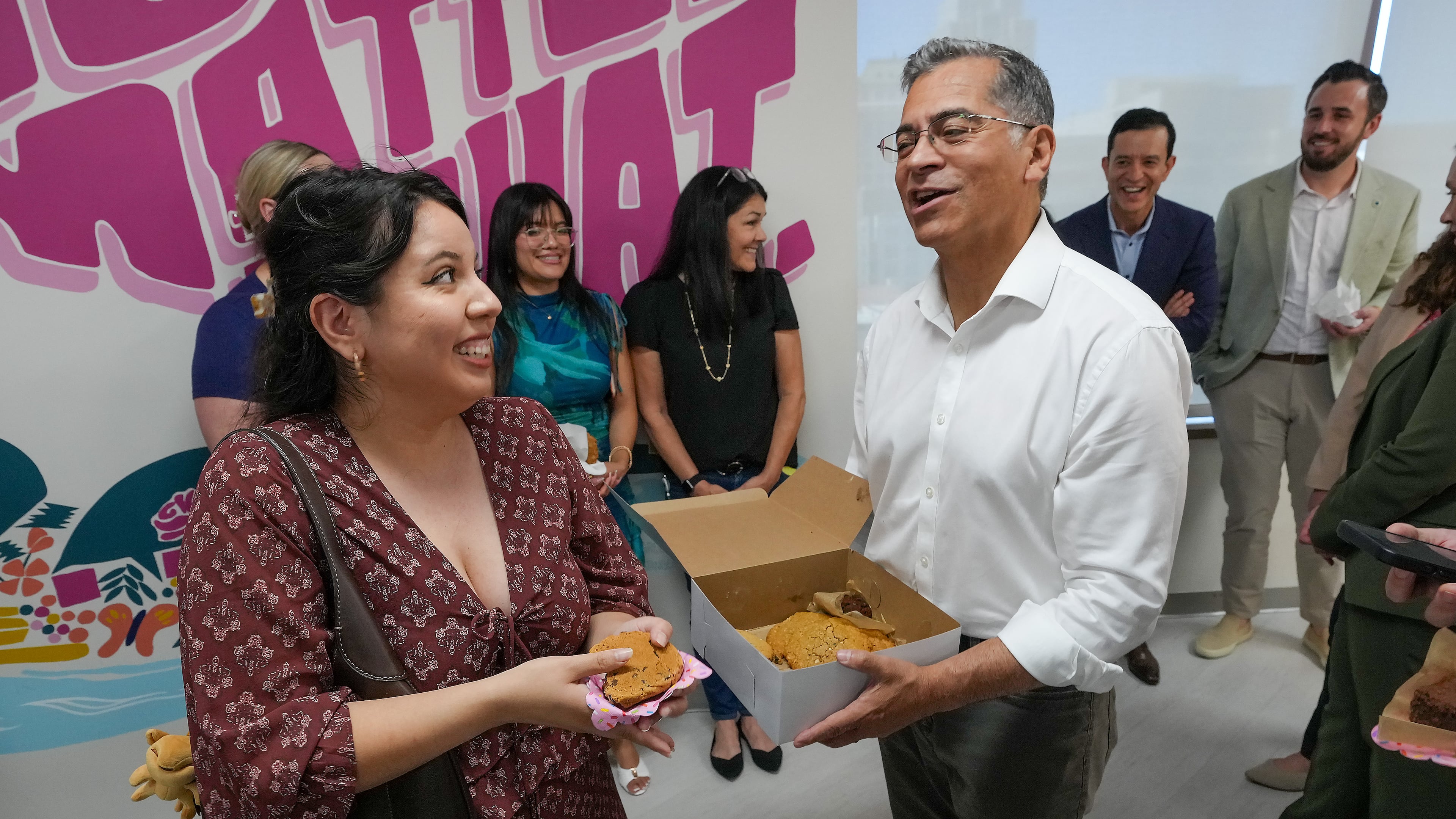 California Democratic gubernatorial candidate Xavier Becerra thanks Amy Perez for her support as he passes out cookies at the Planned Parenthood headquarters in Sacramento, Calif., Monday, June 1, 2026. (AP Photo/Rich Pedroncelli)