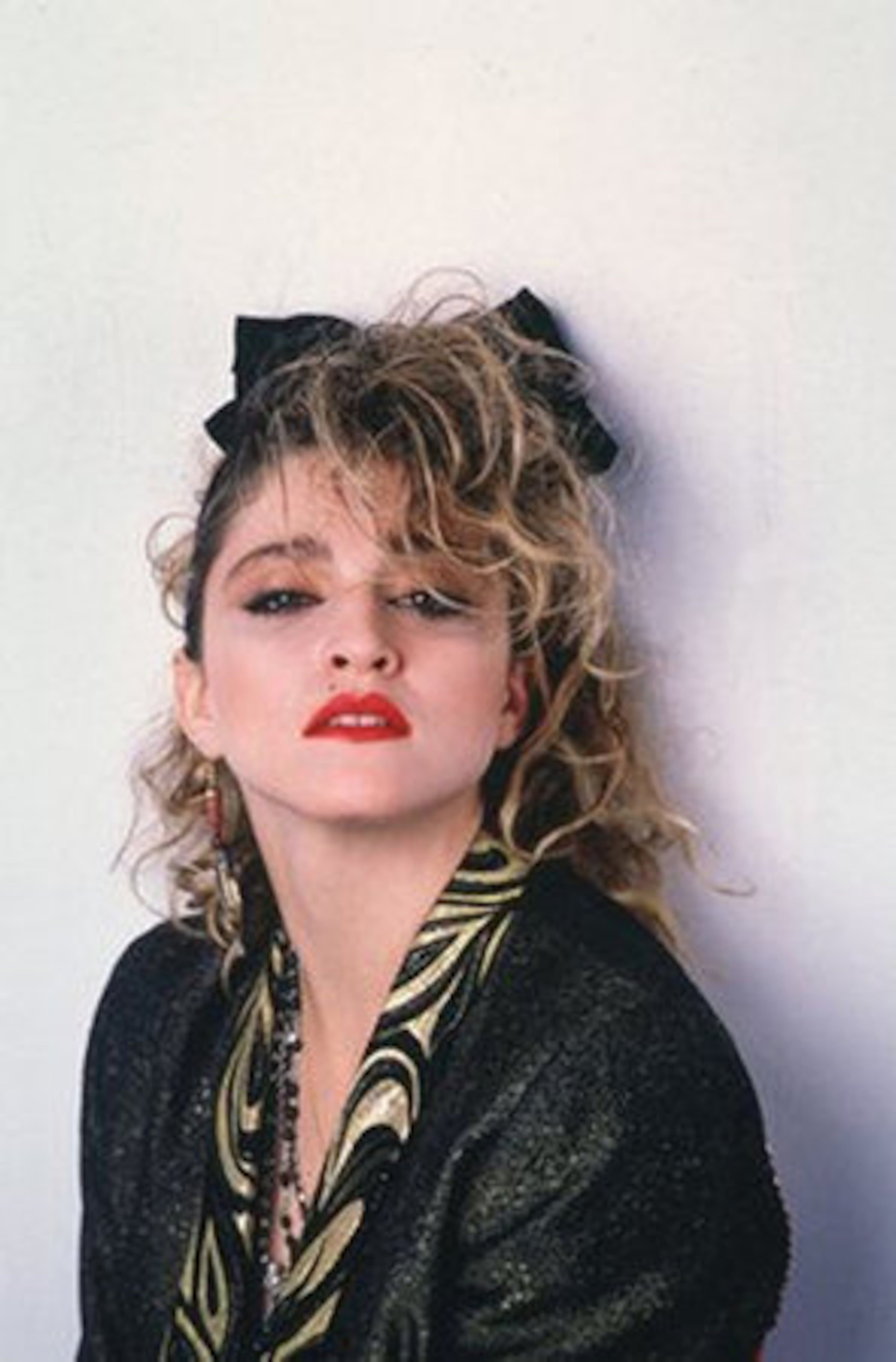 ACTING: Madonna has been pretty good in a few roles such as "Desperately Seeking Susan" in 1985 (here she's dressed as the film's main character Susan.) The film's plot: A bored suburban housewife, seeking adventure to her life, accidentally gets hit on the head, wakes up with amnesia, and is mistaken for a free-spirited New York City drifter named Susan.