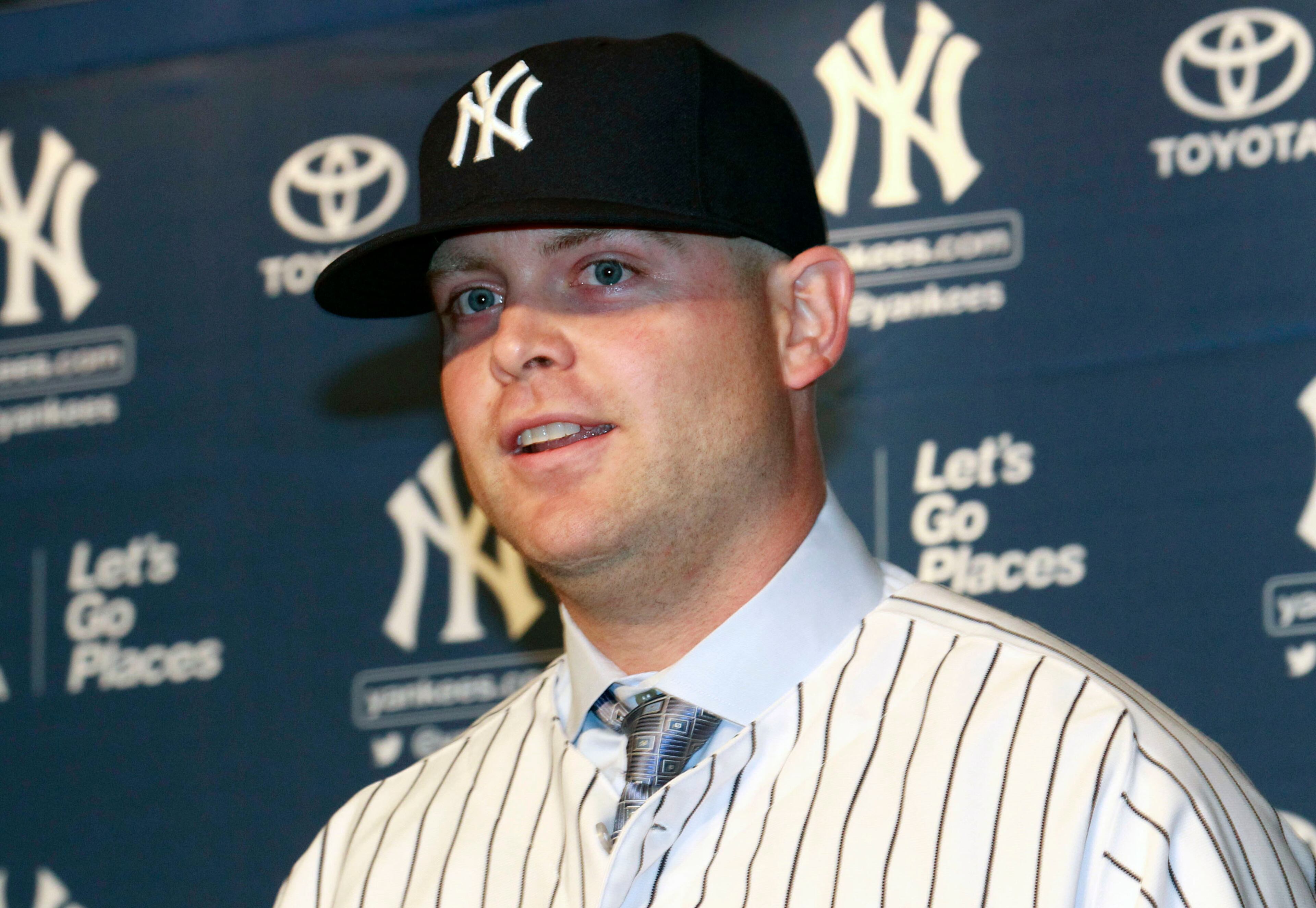 Brian McCann talks to reporters at Yankee Stadium.