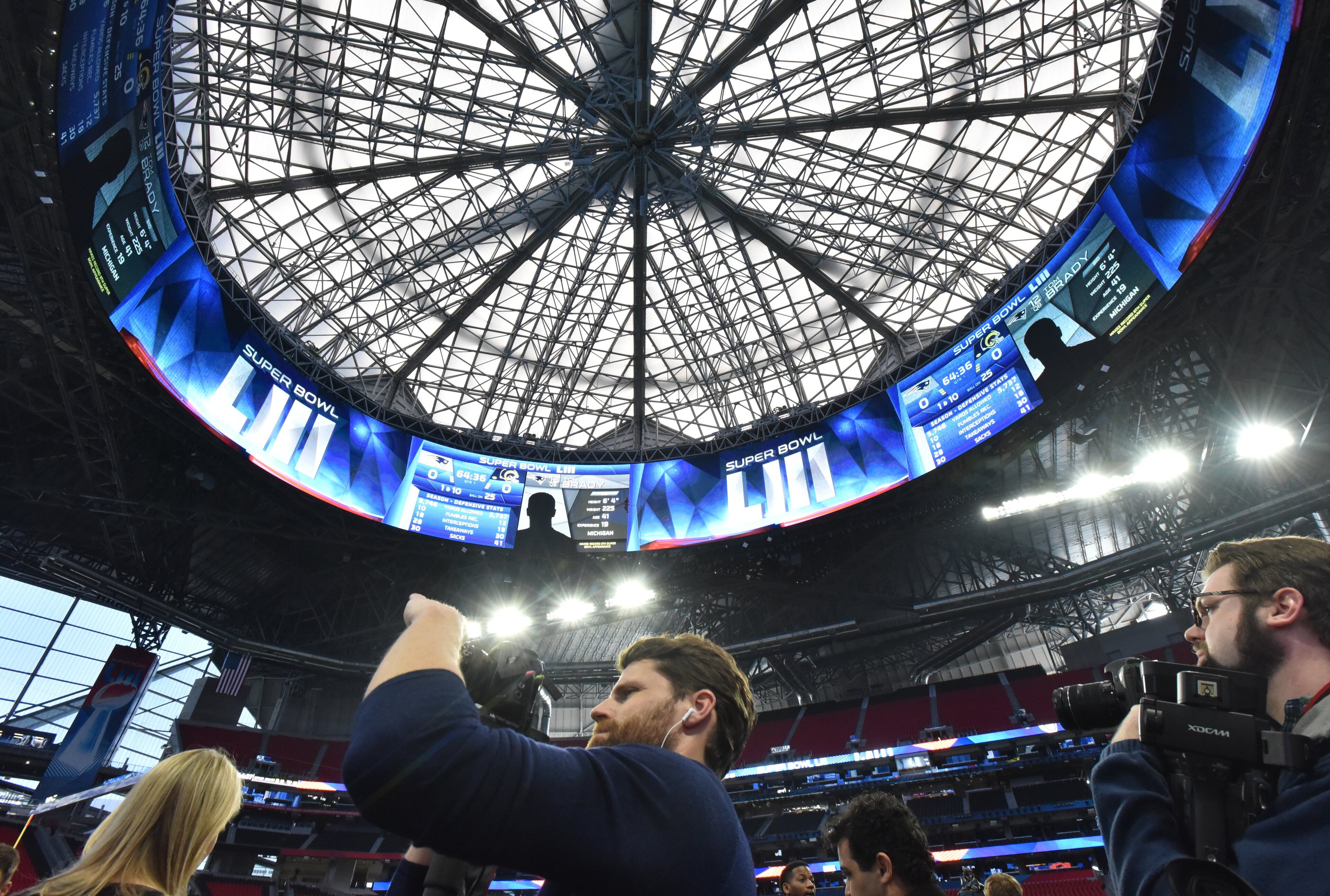 January 29, 2019 Atlanta - Members of the press film as stadium crew works inside Mercedes-Benz Stadium getting it ready for the Super Bowl LIII between New England Patriots and Los Angeles Rams on Tuesday, January 29, 2019. HYOSUB SHIN / HSHIN@AJC.COM