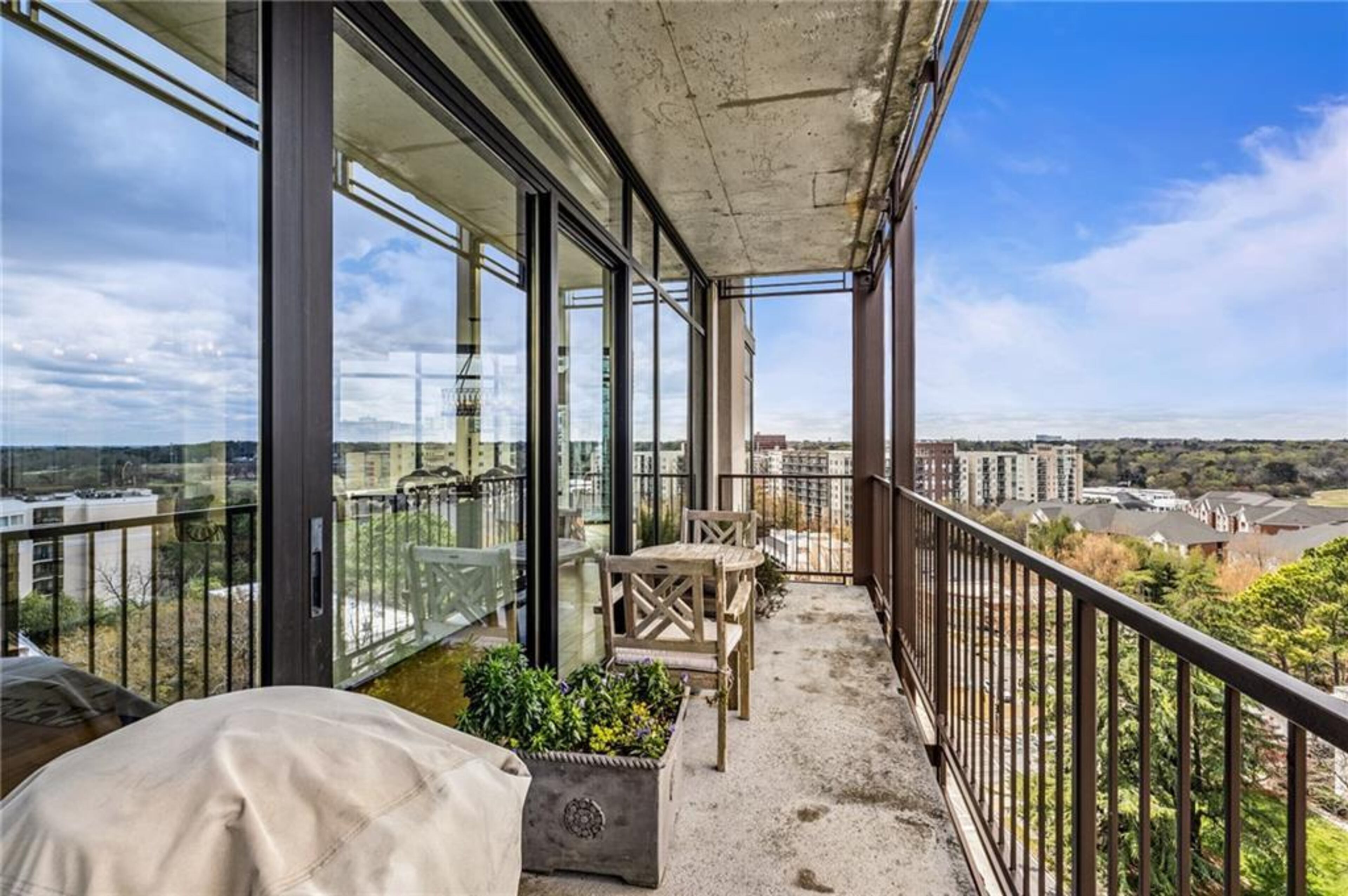 Panoramic sweeping views over the Midtown/Buckhead Skyline make this corner unit in sought-after boutique building, The Astoria, utterly stunning. Text by Alex Smith Meier.