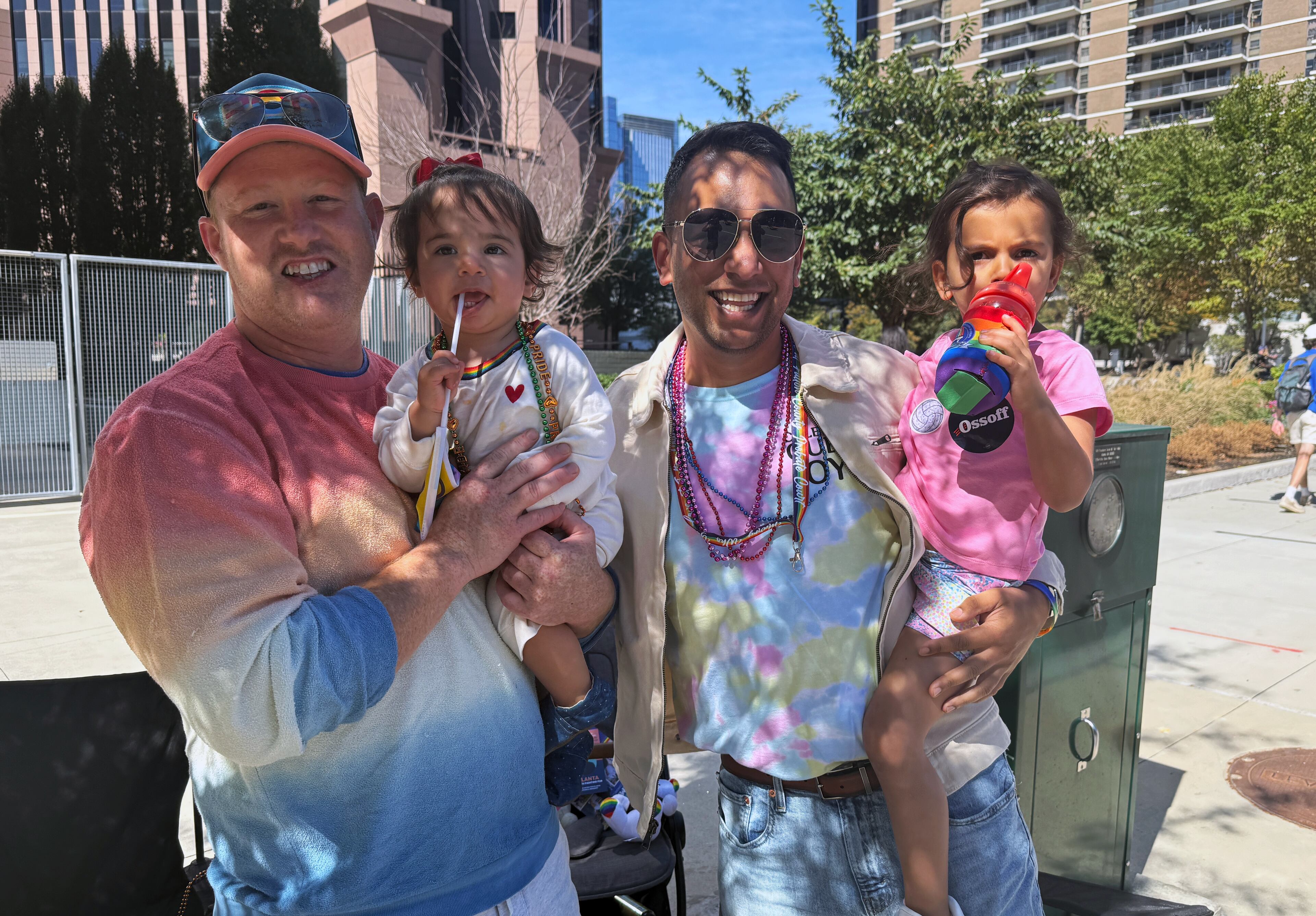 Jason Ahmed (left), 44, and his husband, Faraz Ahmed, 38, with their daughters Rumi (right), 3, and Aamal, 1. (Danielle Charbonneau/AJC)