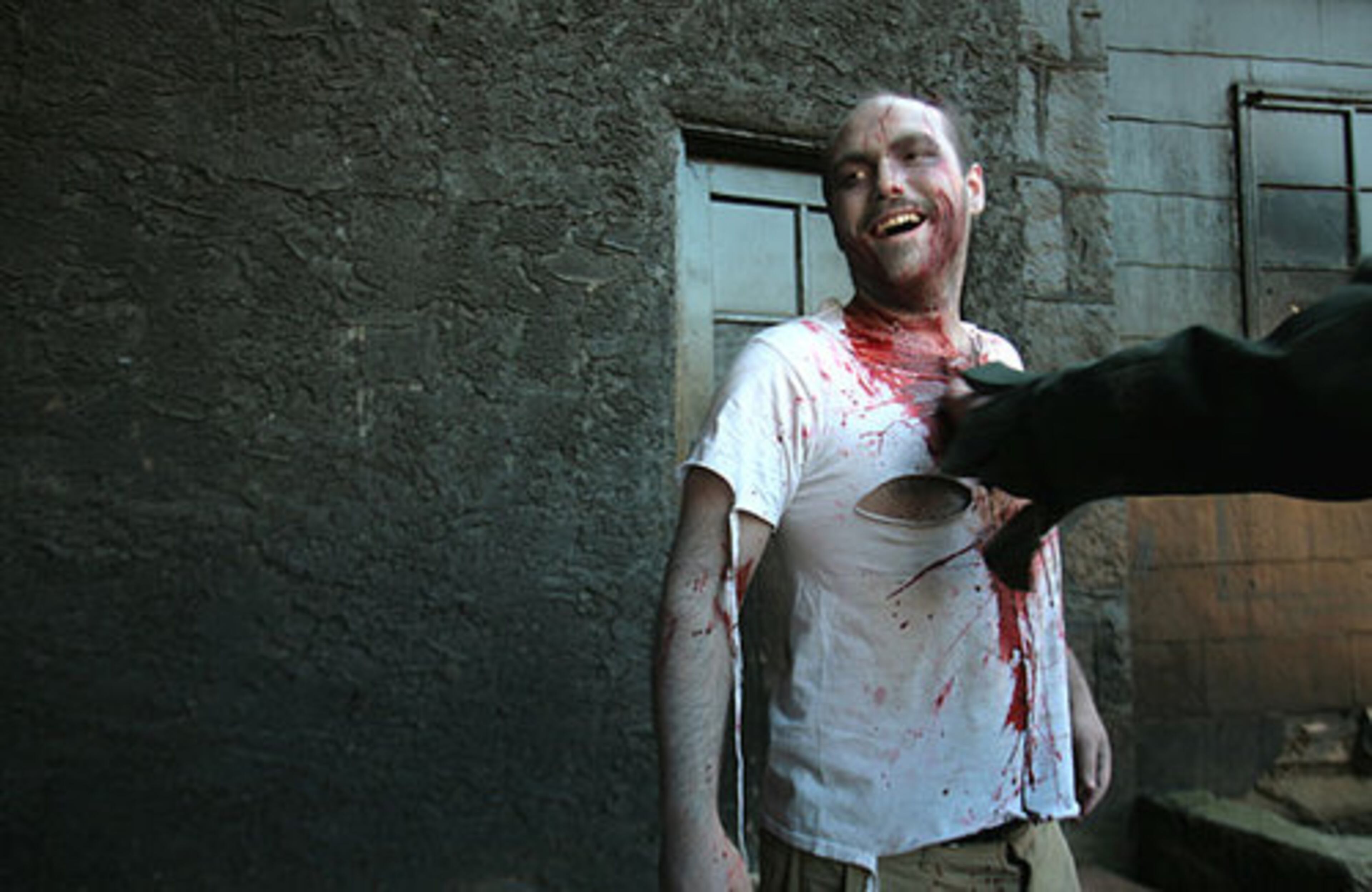 Paul Pattillo of Alpharetta gets splashed with fake blood as he prepares for the Zombie Walk.