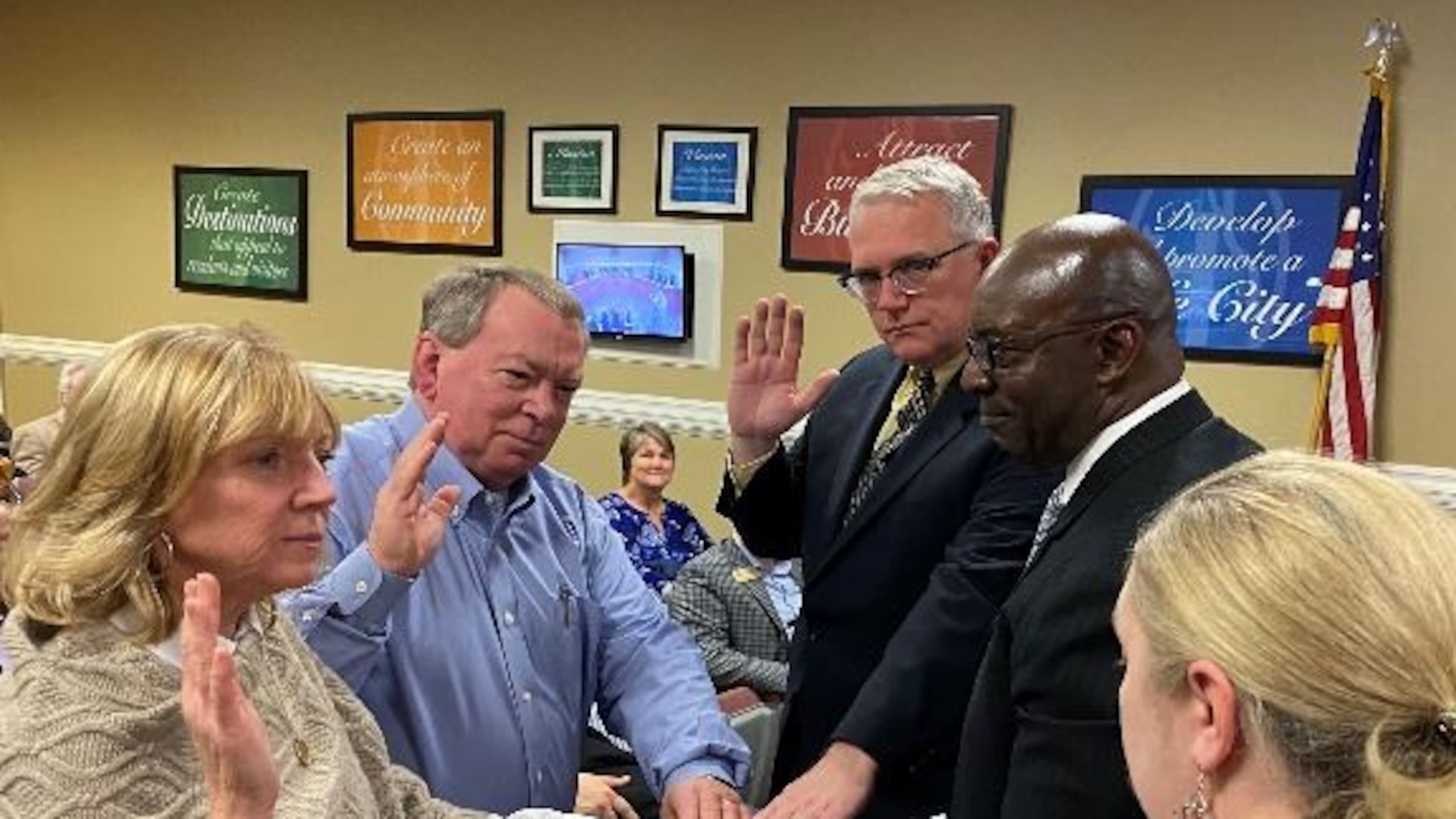 (L-R) Sheila Marshal, Ra Barr and Kent Shelton took their oaths of office on Jan. 6 as appointed members of the Development Authority of Powder Springs by Mayor Al Thurman and City Clerk Kelly Axt. (Courtesy of Powder Springs)