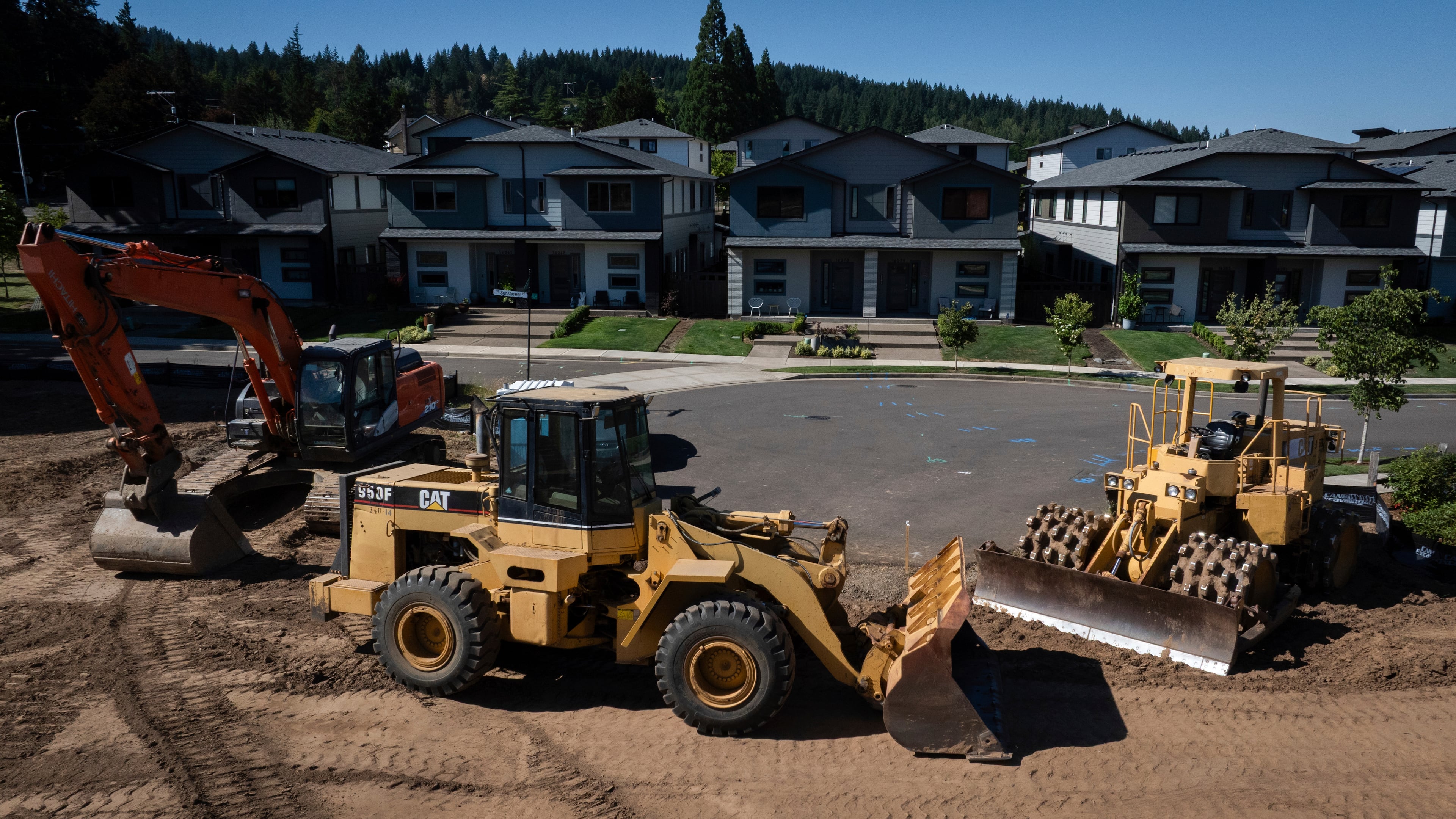 FILE - Construction equipment is seen near new homes on July 11, 2025, in Happy Valley, Ore. (AP Photo/Jenny Kane, File)