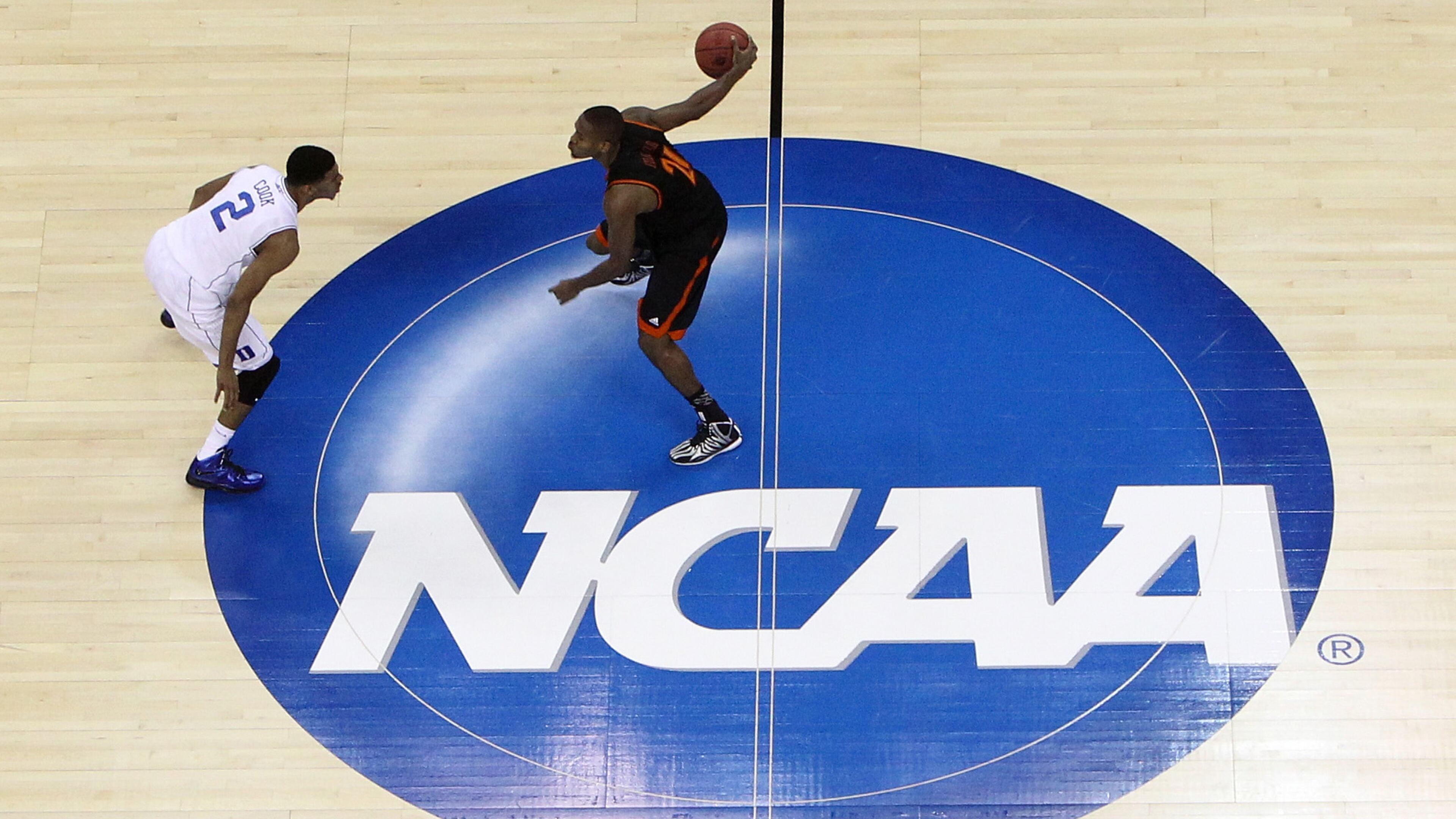 Langston Hall of the Mercer Bears brings up the ball against Quinn Cook of the Duke Blue Devils during their matchup in the 2014 NCAA Men's Basketball Tournament at PNC Arena on March 21, 2014 in Raleigh, N.C.