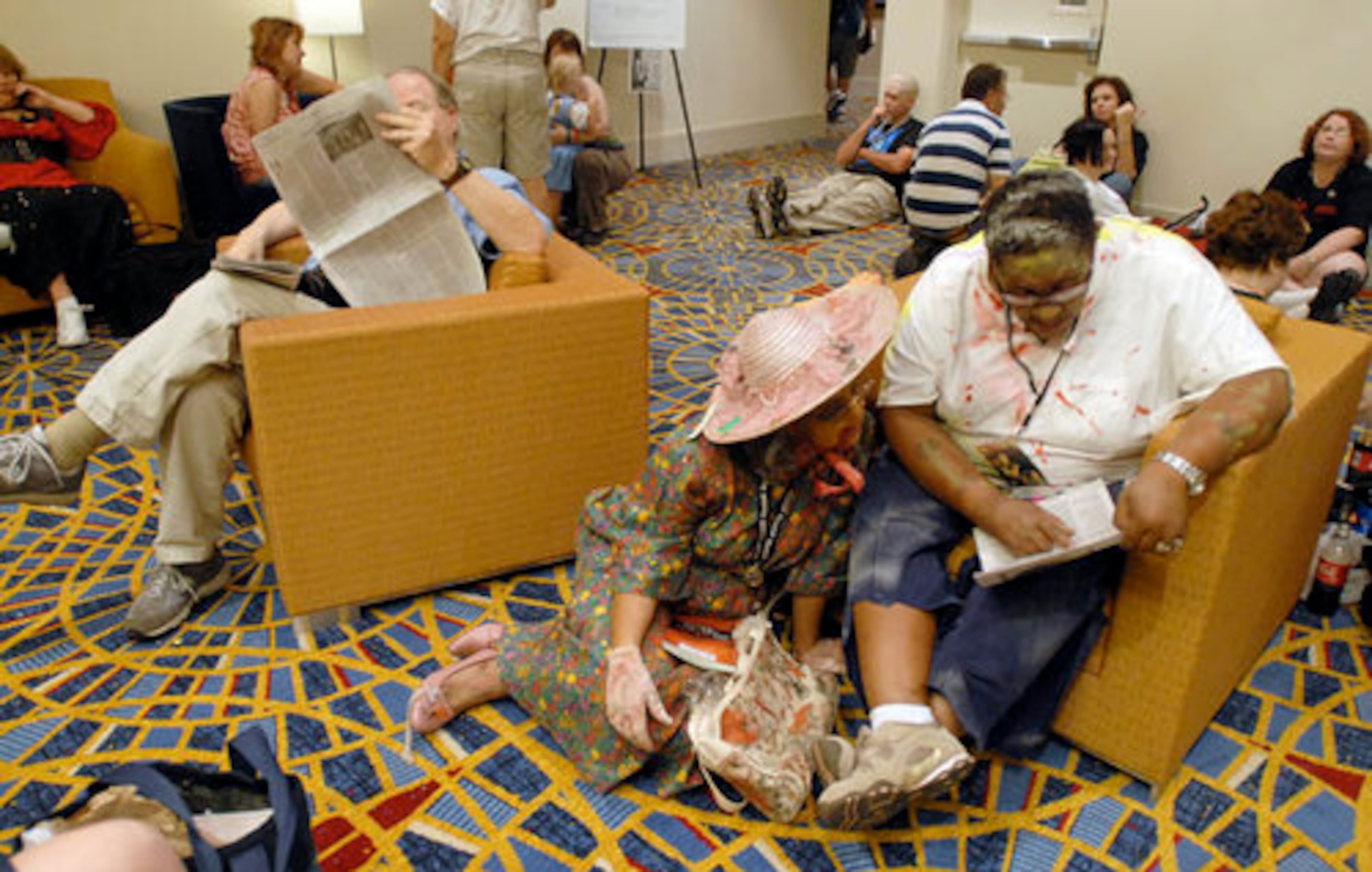 Zombies (l-r) Charmayne Johnson and Carol Nichols go over the Schedule at the Mariott Marquis.