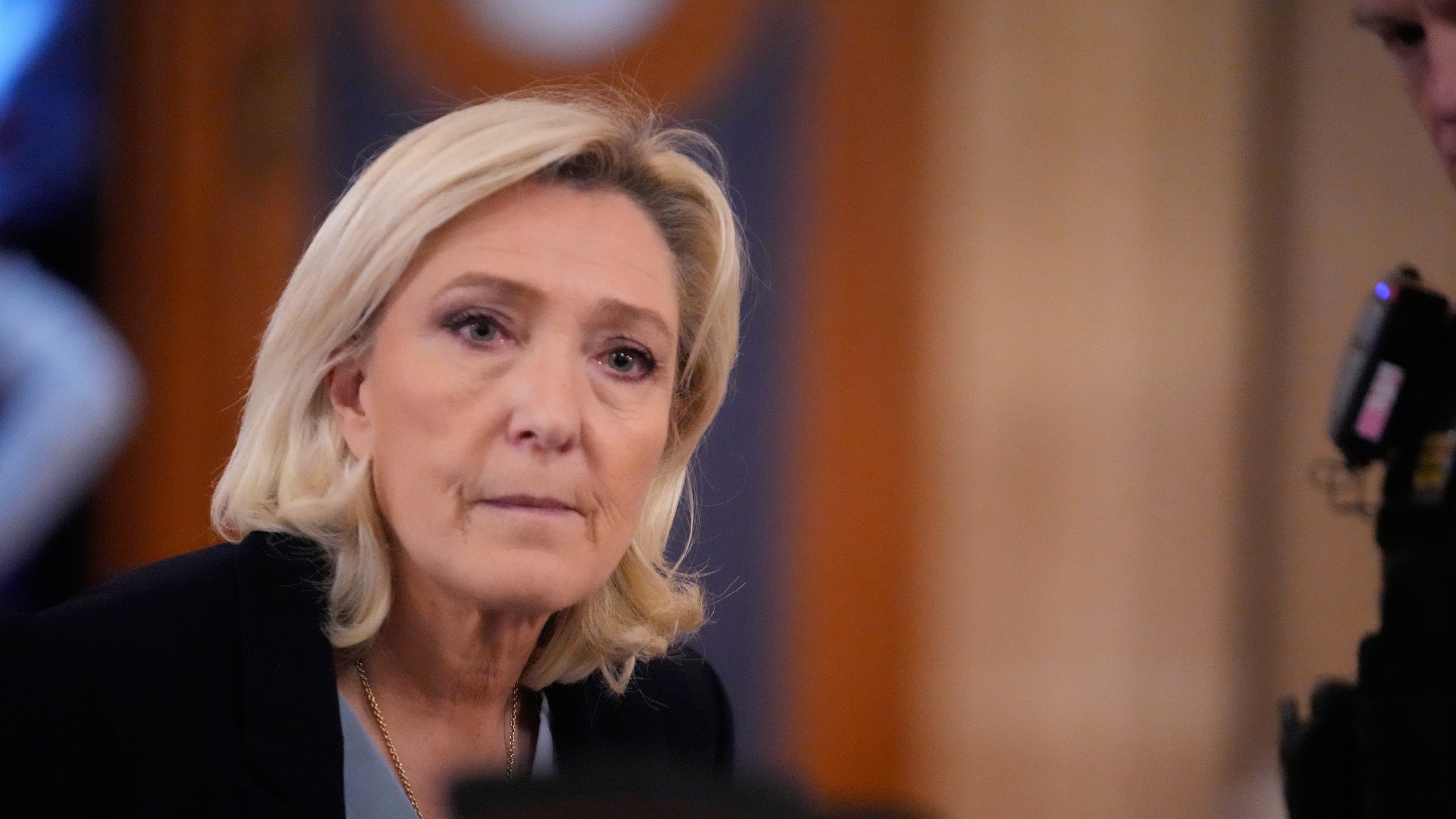 FILE - Far-right leader Marine Le Pen walks outside the courtroom during a short break in her appeals trial in Paris, on Jan. 20, 2026. (AP Photo/Michel Euler, File)