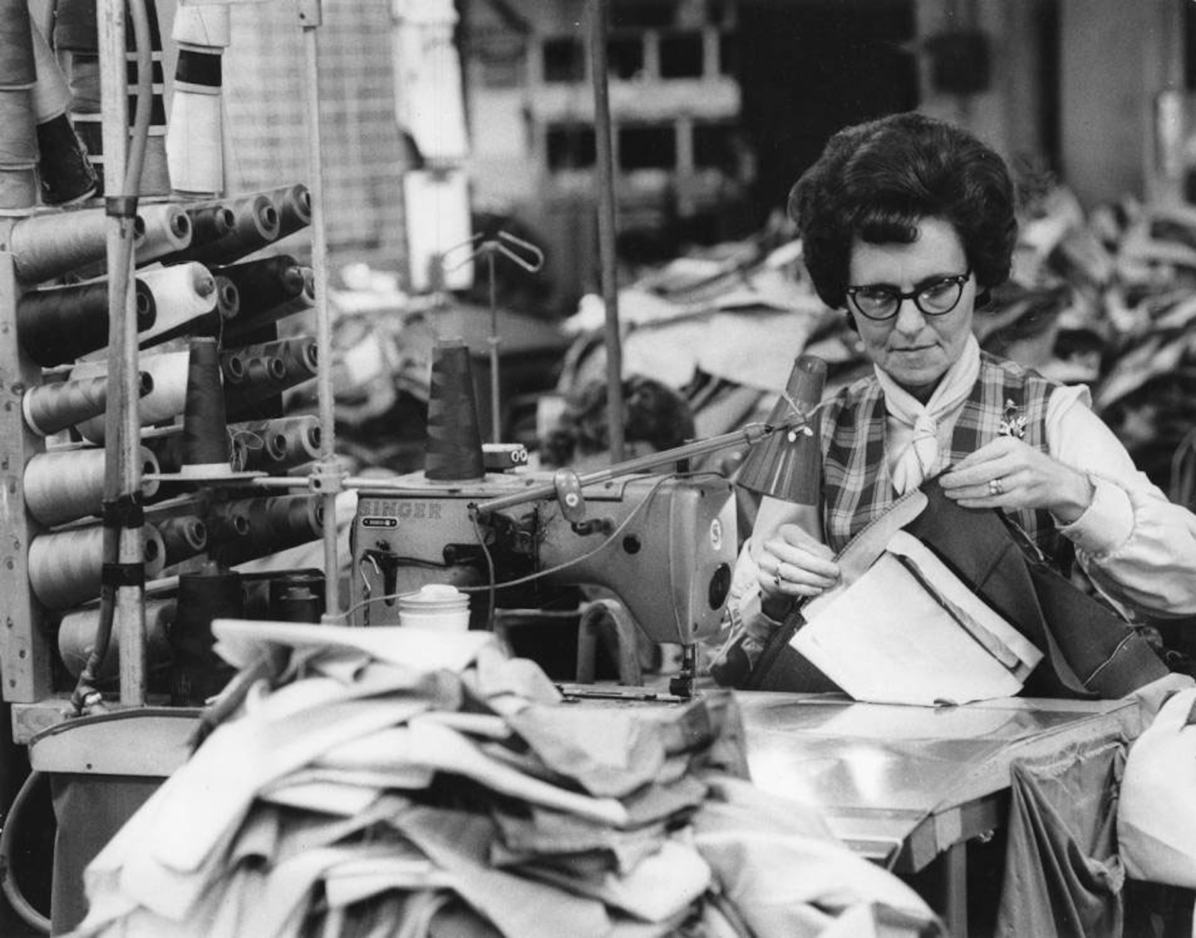 Dec. 12, 1972: Textile worker Frances Popham, stitching together men's slacks, is one of 650 workers at Georgia converters in Bremen. (AJC Archive at GSU Library AJCP315-044e)