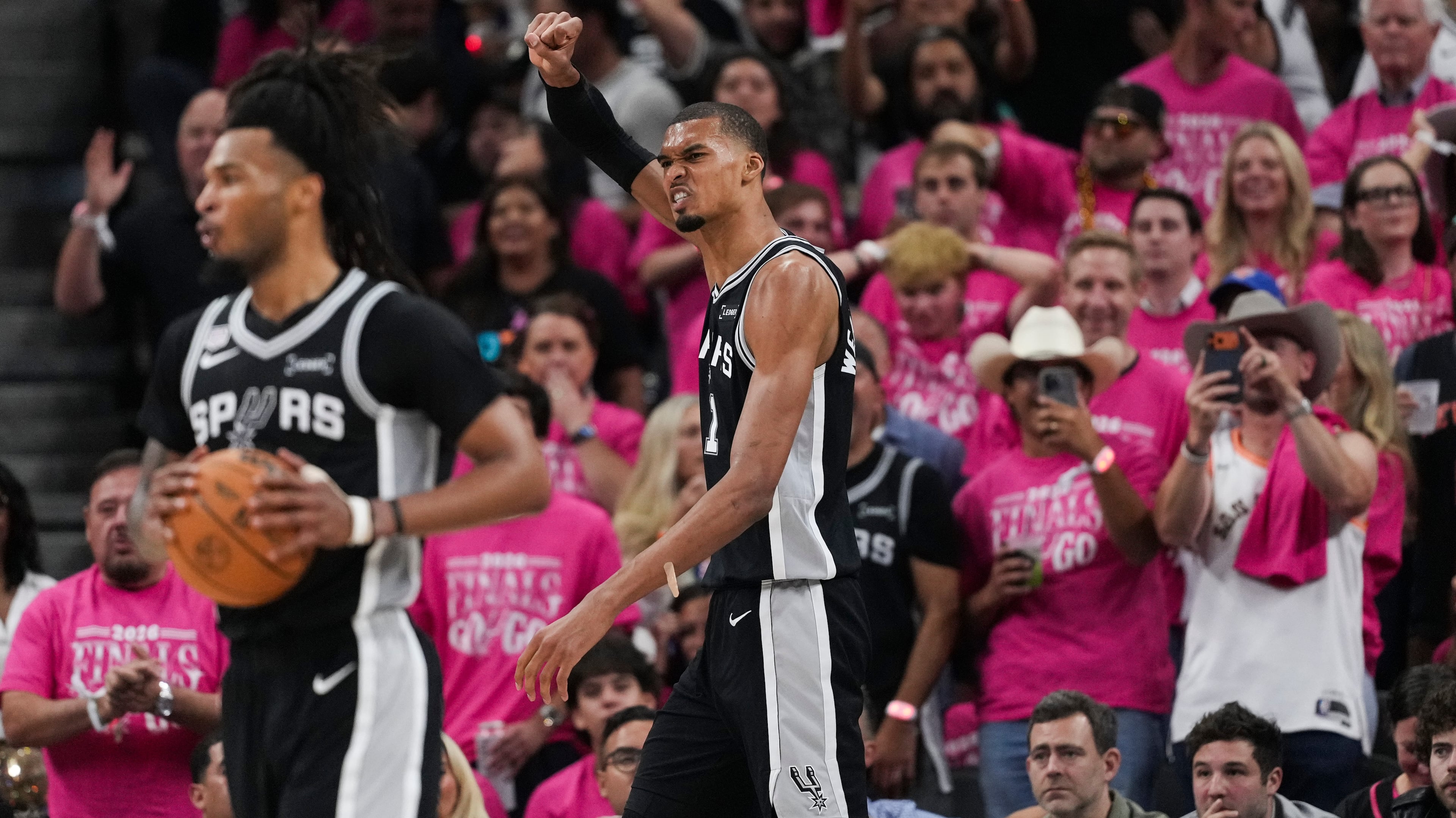 San Antonio Spurs forward Victor Wembanyama (1) celebrates a basket against the New York Knicks during the second half of Game 1 of the NBA Finals basketball series, Wednesday, June 3, 2026, in San Antonio. (AP Photo/Eric Gay)