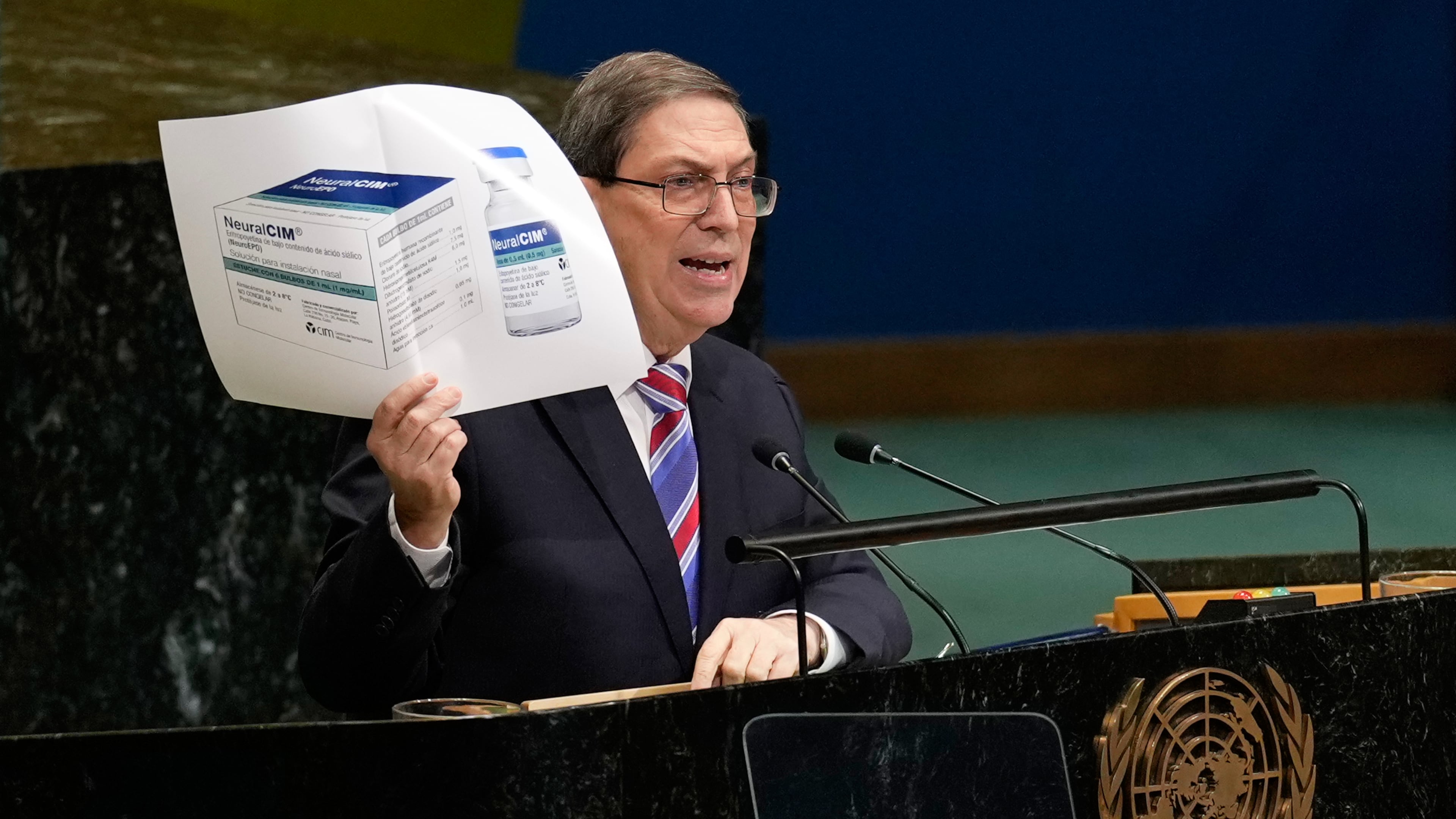 Cuban foreign minister Bruno Rodriguez Parrilla holds up a photo of a medication while speaking at United Nations headquarters, Wednesday, Oct. 28, 2026. (AP Photo/Seth Wenig)