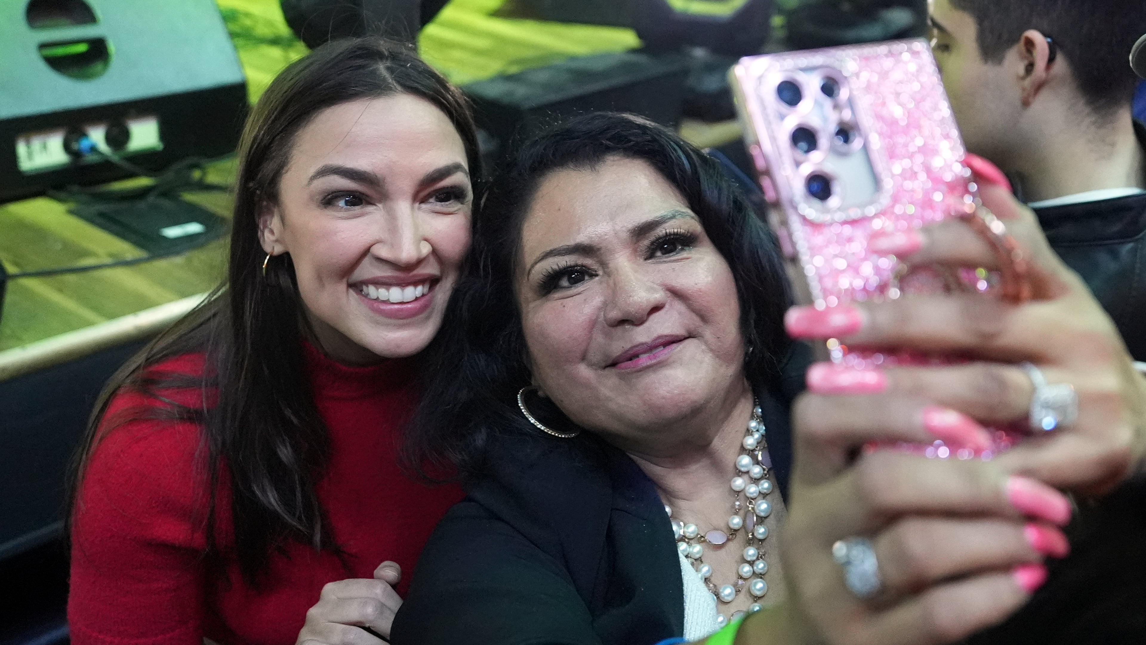 Rep. Alexandria Ocasio-Cortez, left, D-N.Y., poses for a photo with a supporter during a campaign rally for Randy Villegas, Democratic candidate for congress in California's 22nd District, Friday, Oct. 23, 2026, in Bakersfield, Calif. (AP Photo/Jae C. Hong)