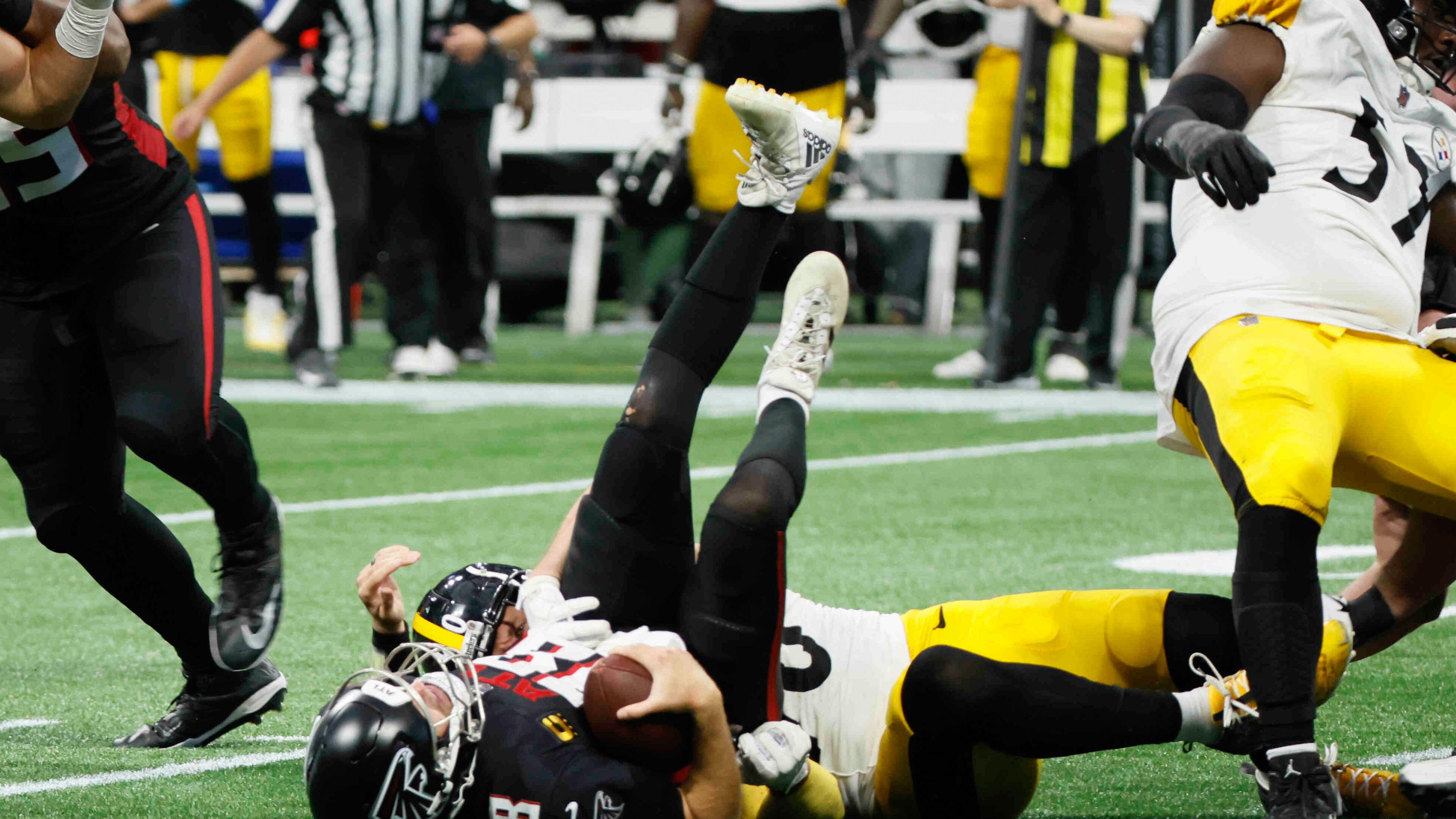 Atlanta Falcons quarterback Kirk Cousins (18) lays on the ground after being sacked in the last play of the game on Sunday, Sept. 8, at Mercedes-Benz Stadium in Atlanta. The Falcons lost 18-10.
(Miguel Martinez/ AJC)