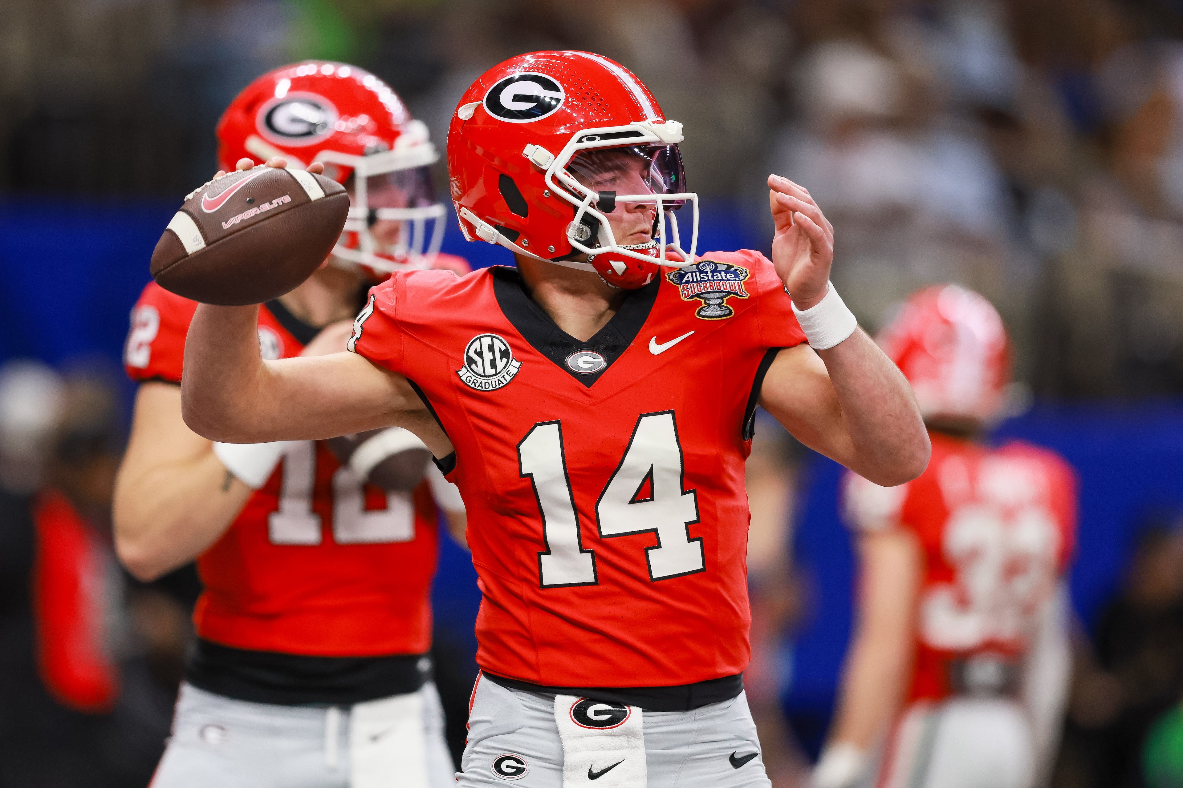 Georgia Bulldogs quarterback Gunner Stockton (14) warms up before the NCAA College Football Playoff quarterfinal game against Ole Miss at the Sugar Bowl in the Caesars Superdome, Thursday, Jan. 1, 2026, in New Orleans. (Jason Getz/AJC)