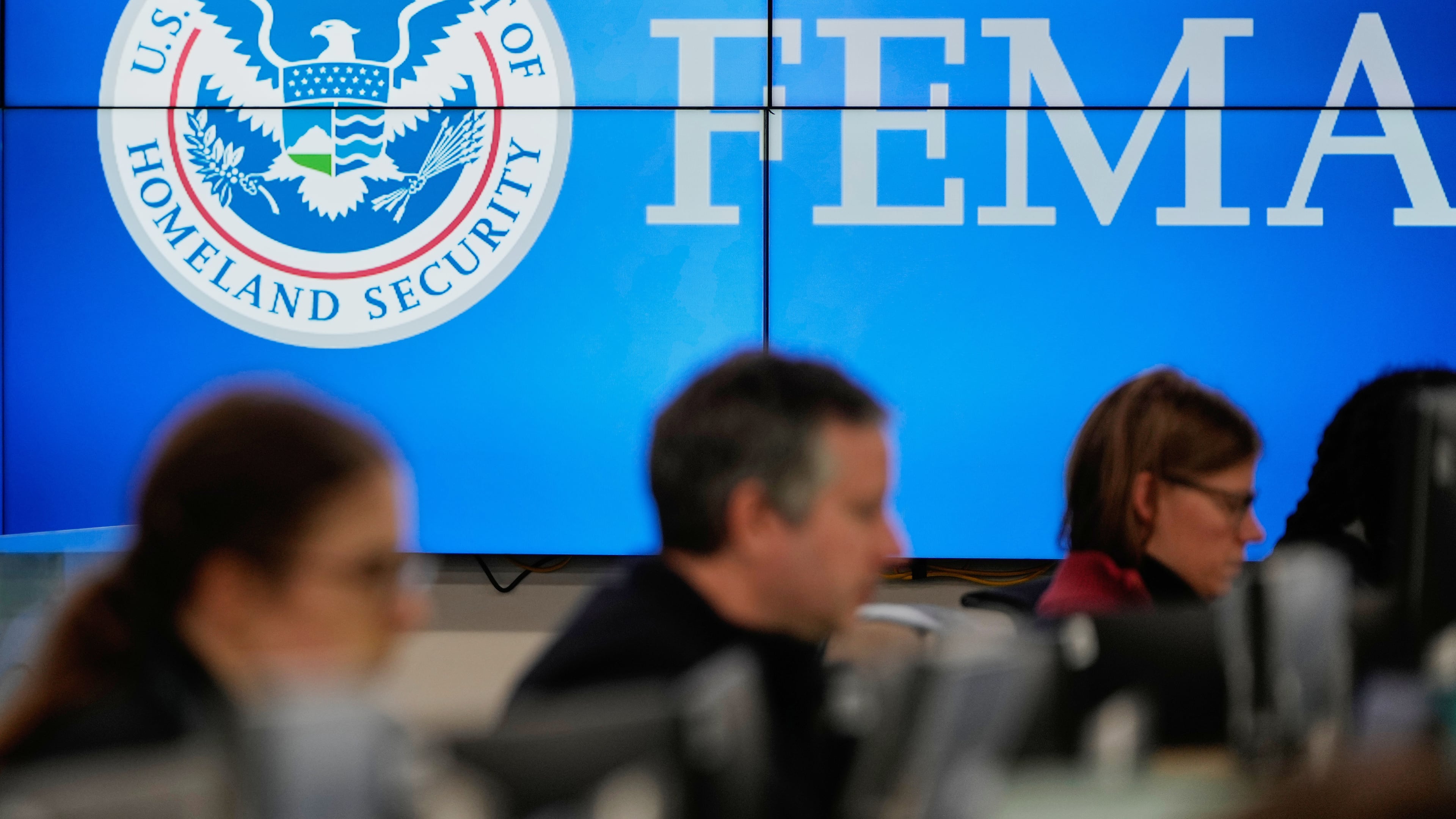FILE - People work at the Federal Emergency Management Agency headquarters in Washington, Jan. 24, 2026. (AP Photo/Julia Demaree Nikhinson, File)