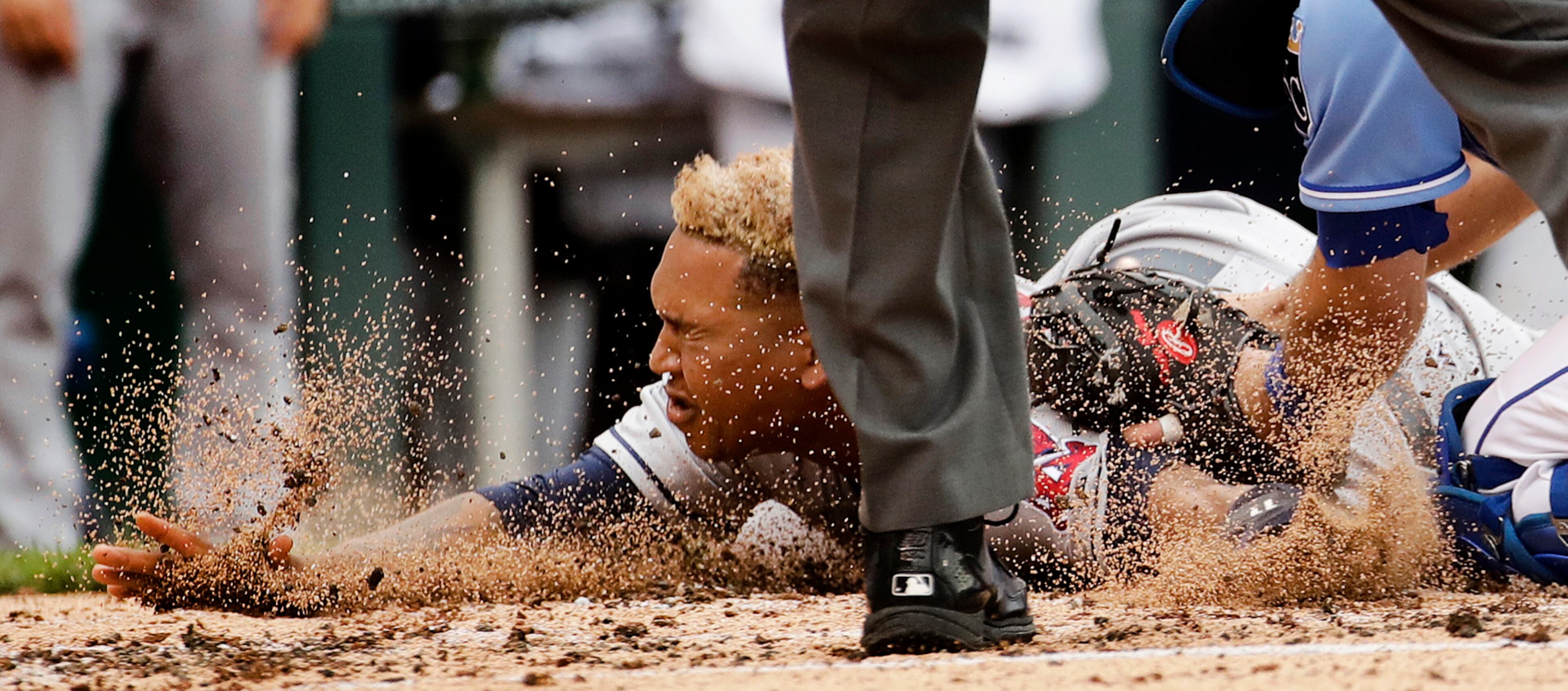 Cleveland Indians' Jose Ramirez is tagged out at home by Kansas City Royals catcher Drew Butera as he tried to score on a double by Austin Jackson during the fourth inning of a baseball game Sunday, June 4, 2017, in Kansas City, Mo. (AP Photo/Charlie Riedel)