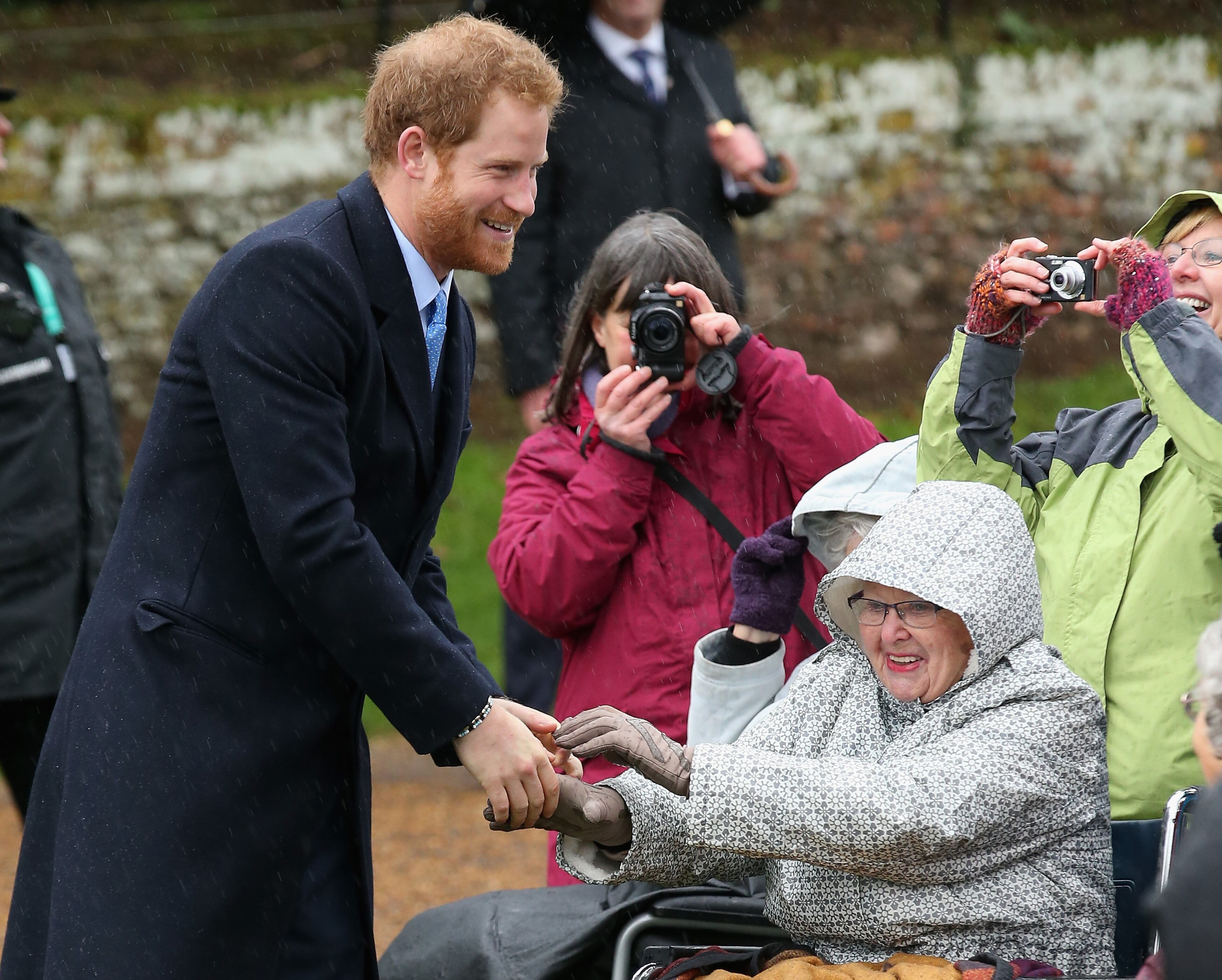 KING'S LYNN, ENGLAND - DECEMBER 25: Prince Harry meets members of the public as he attends a Christmas Day church service at Sandringham on December 25, 2015 in King's Lynn, England. (Photo by Chris Jackson/Getty Images)