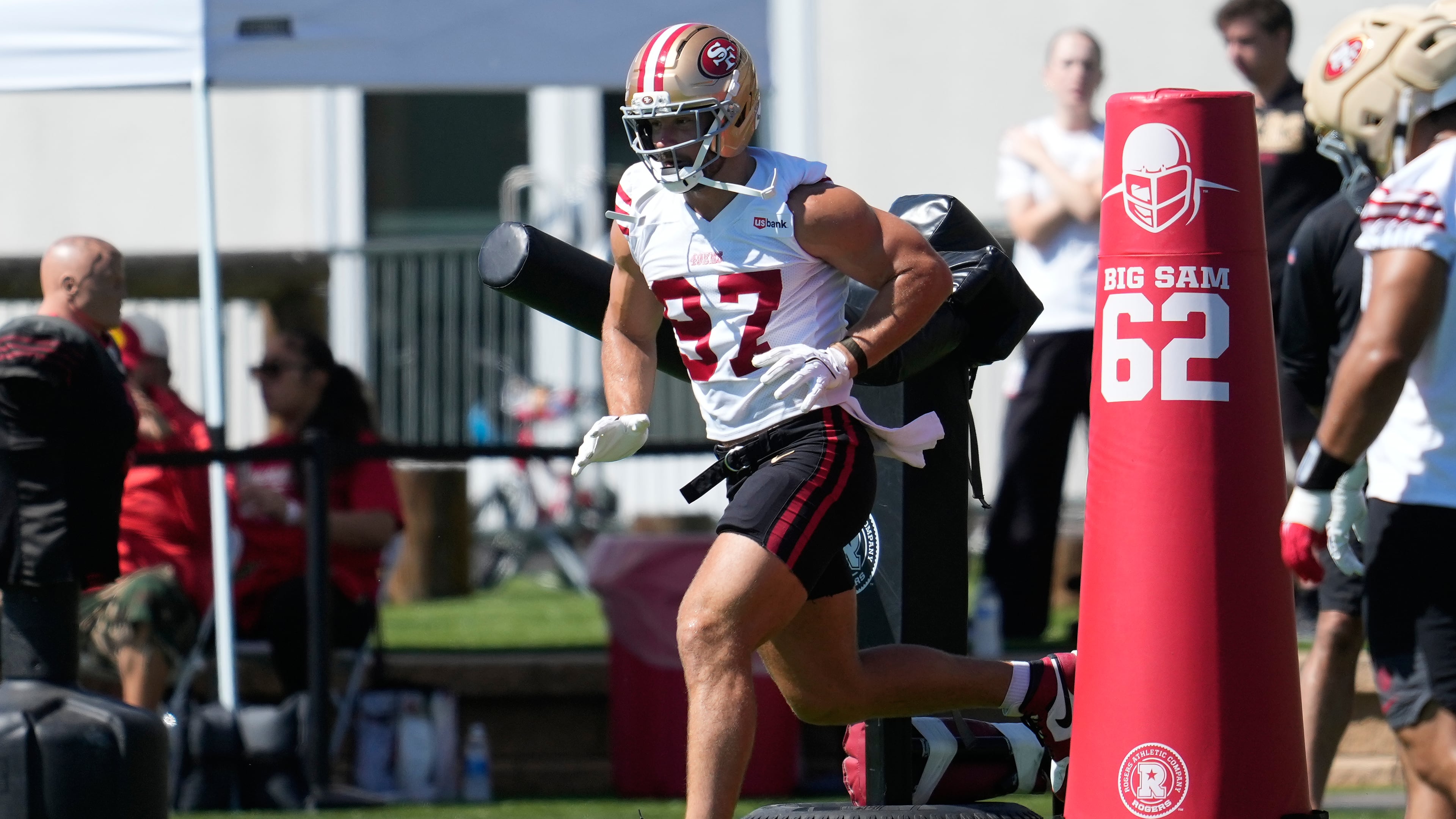 FILE - San Francisco 49ers defensive end Nick Bosa (97) runs a drill during the NFL football team's training camp, on July 27, 2026, in Santa Clara, Calif. (AP Photo/Jeff Chiu, File)
