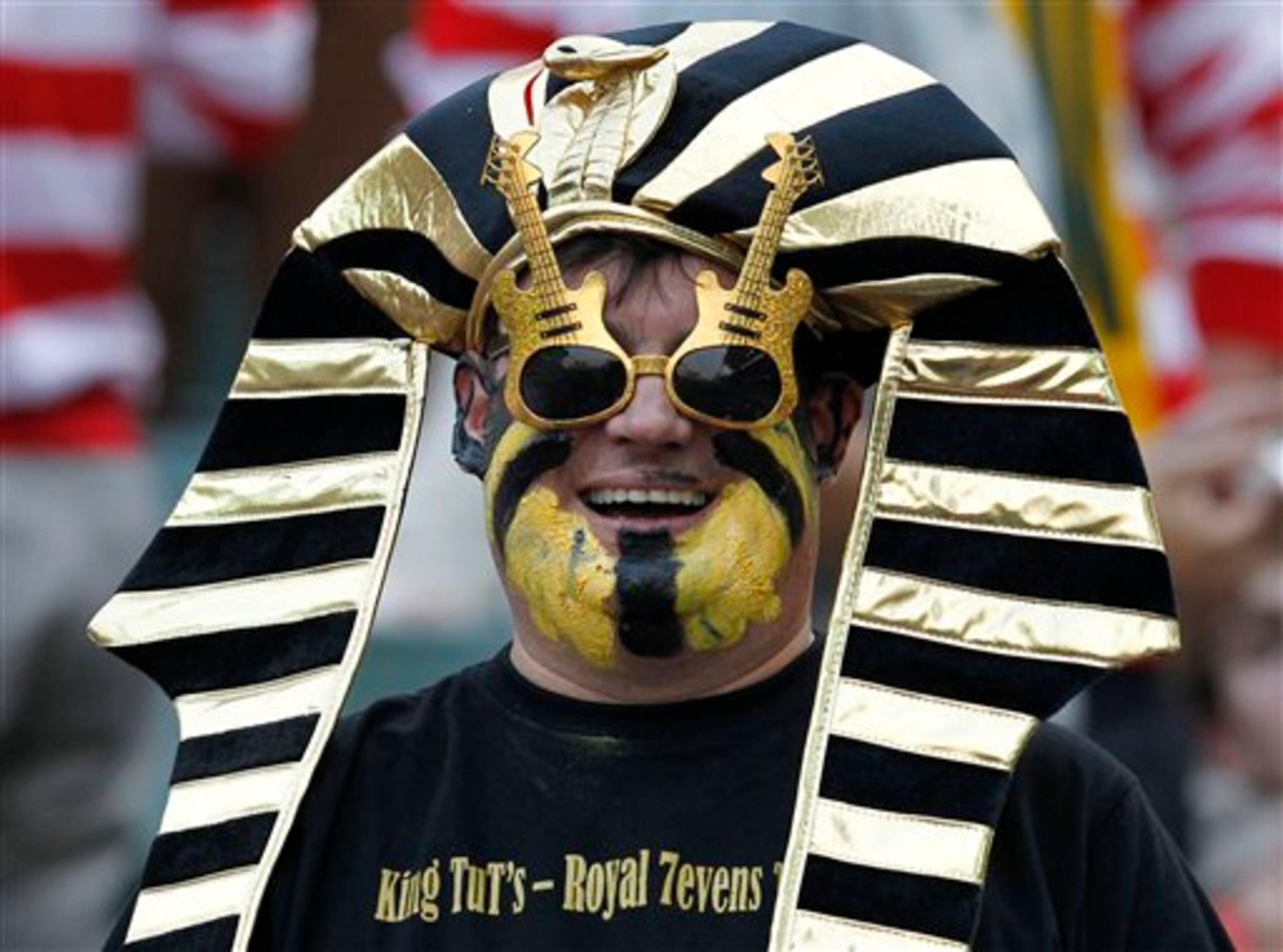 A rugby fan smiles during the first day of Hong Kong Sevens rugby tournament in Hong Kong, Friday, March 22, 2013. (AP Photo/Vincent Yu)
