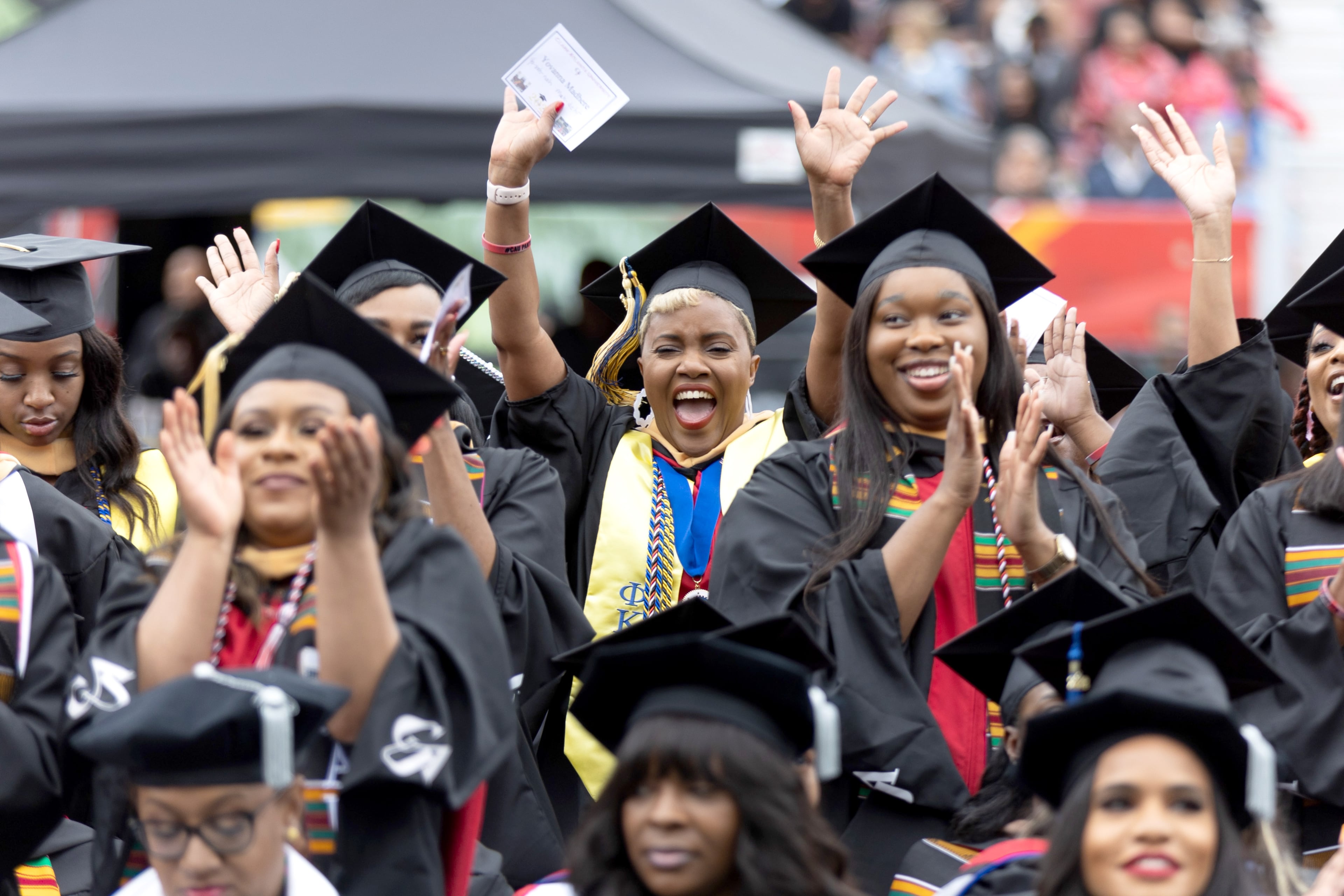 Graduates celebrate during Clark Atlanta University's commencement ceremony in Panther Stadium on Saturday, May 20, 2023. (Steve Schaefer / steve.schaefer@ajc.com)