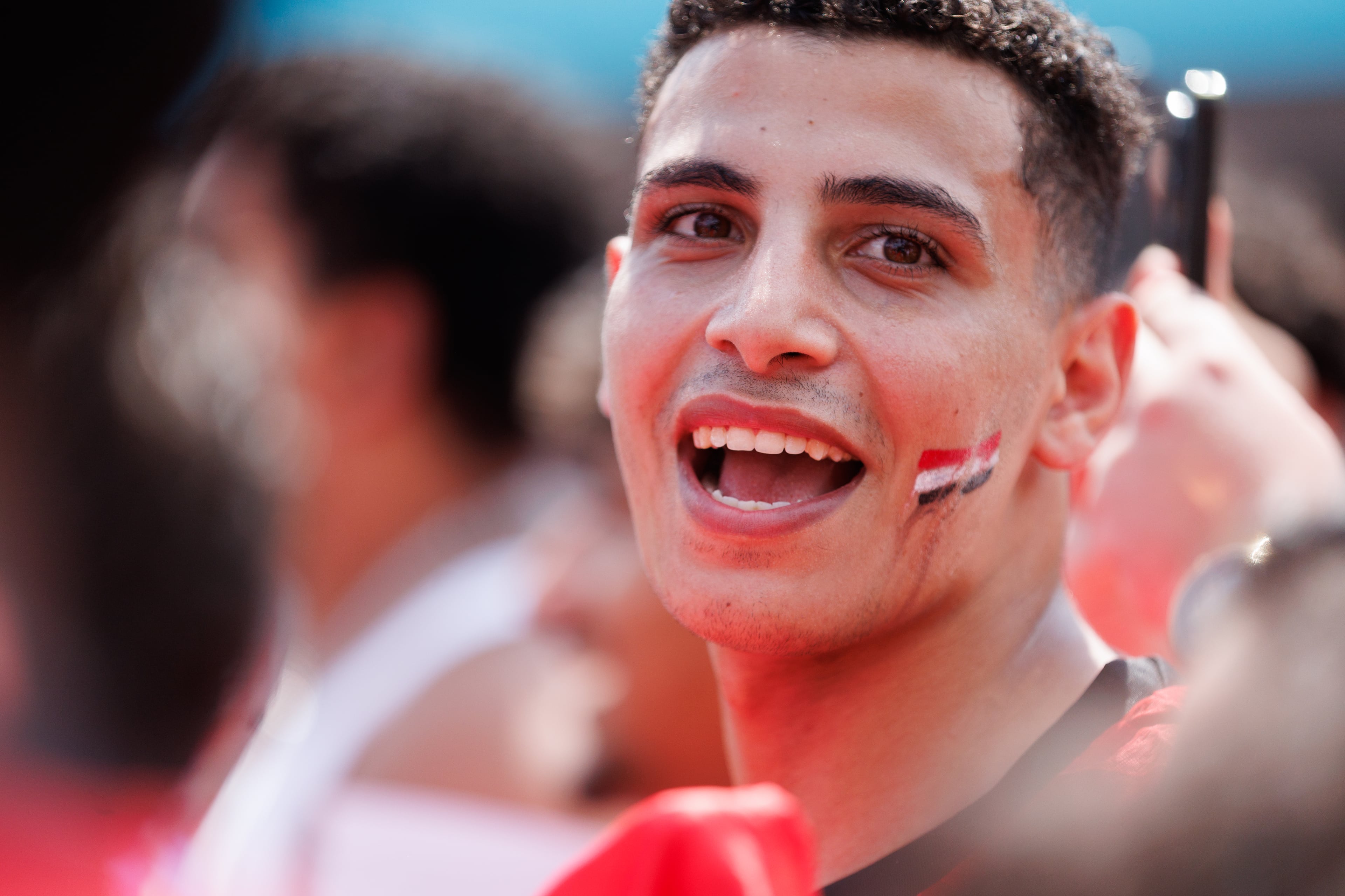 An Egypt fan sings the national anthem at FIFA Fan Fest in Centennial Park in Atlanta ahead of the World Cup game against Argentina in Atlanta Stadium on Tuesday, July 7, 2026. (Estela Muñoz/AJC)