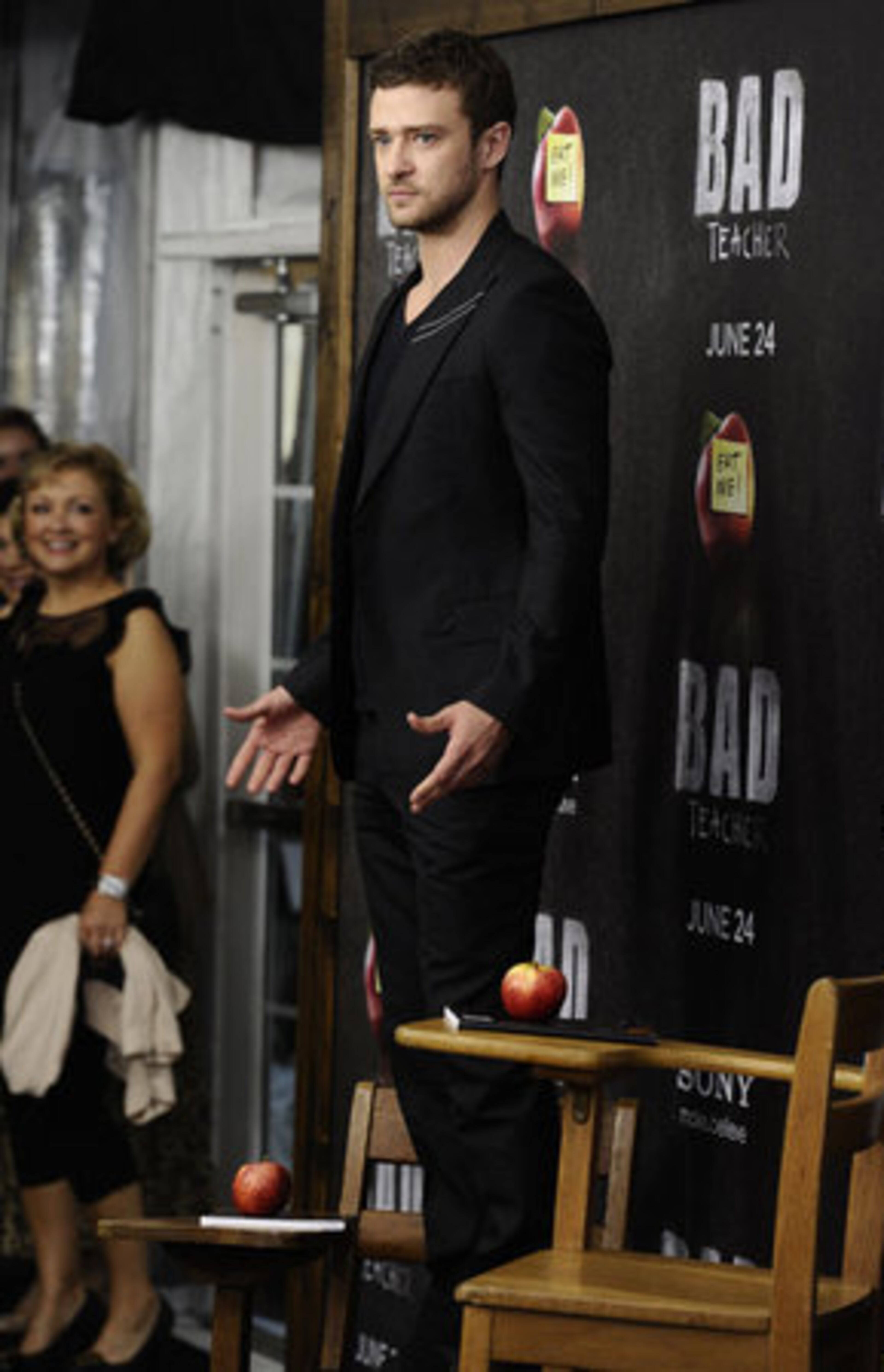 Justin Timberlake strikes a pose for cameras in the red-carpet classroom setting.