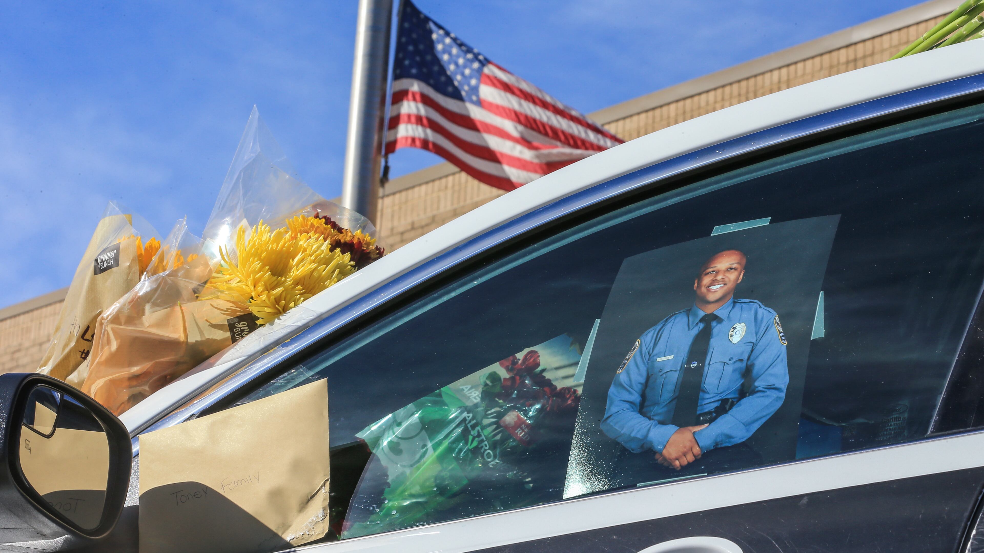 October 22, 2018 Gwinnett County: A memorial to slain Gwinnett County police officer Antwan Toney was in front of the Gwinnett County Police Annex Monday, Oct. 22, 2108 at 800 Hi Hope Rd, in Lawrenceville where flowers, note and candles are growing. JOHN SPINK/JSPINK@AJC.COM