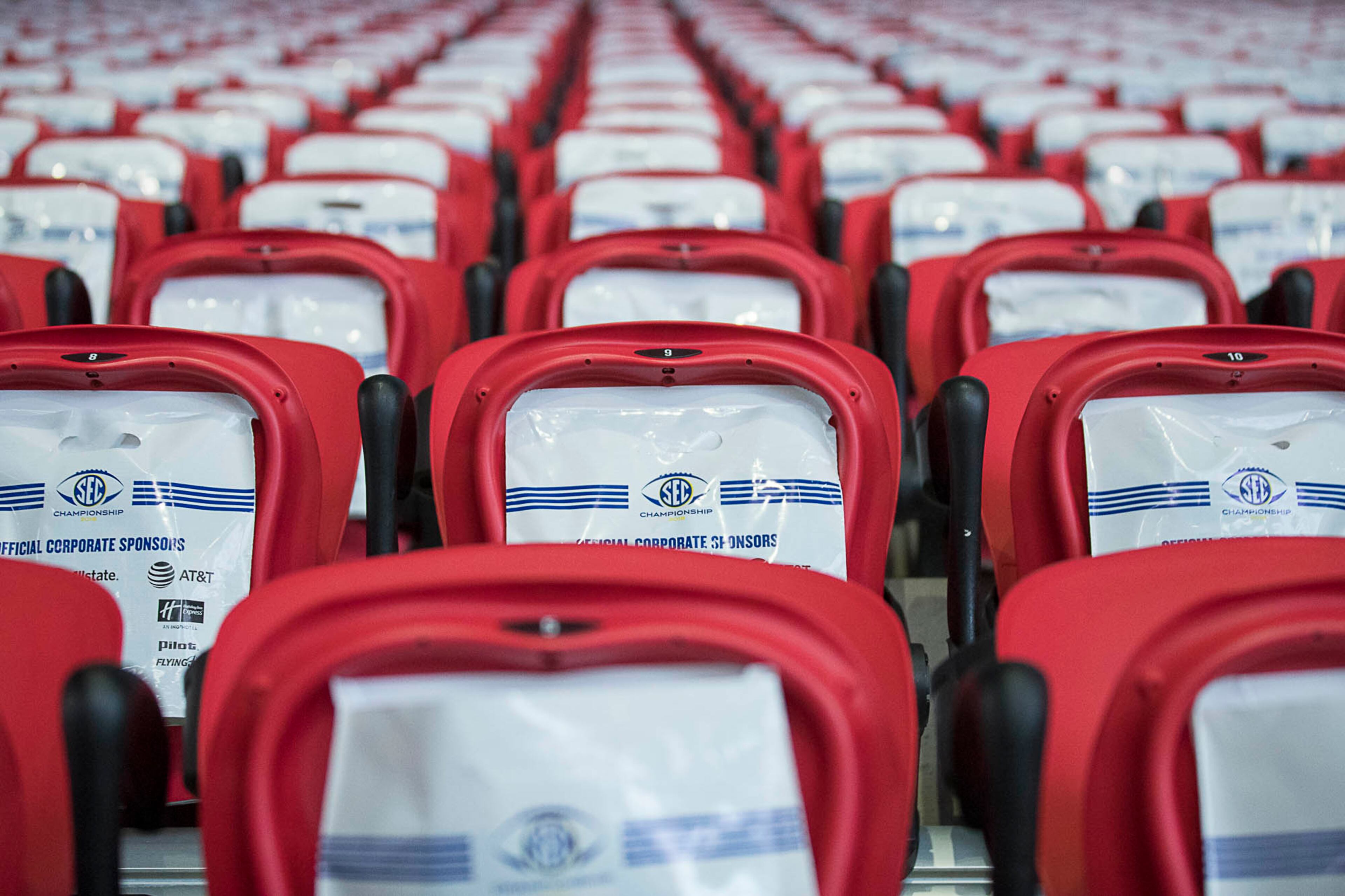 11/30/2018 -- Atlanta, Georgia -- Goodie bags are placed on all seats for game day patrons at Mercedes Benz Stadium, Friday, November 30, 2018. Georgia will play the Alabama in the 2018 SEC Championship football game on Saturday. (ALYSSA POINTER/ALYSSA.POINTER@AJC.COM)
