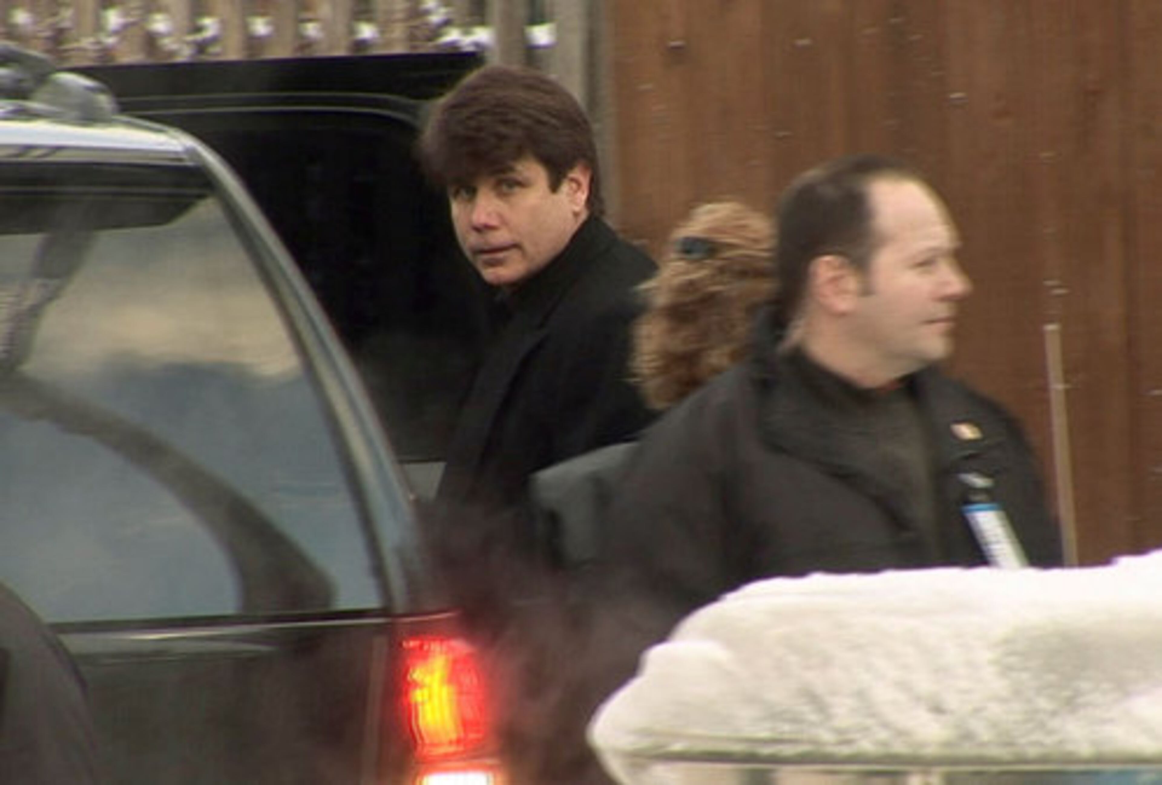 Blagojevich, center, leaves his home through a back alley on Dec. 10, 2008, a day after he was arrested on federal corruption charges. 'December 9 to my family, to us, to me, is what Pearl Harbor Day was to the United States,' Blagojevich said in a recent interview. 'It was a complete surprise, completely unexpected. And just like the United States prevailed in that, we'll prevail in this.'