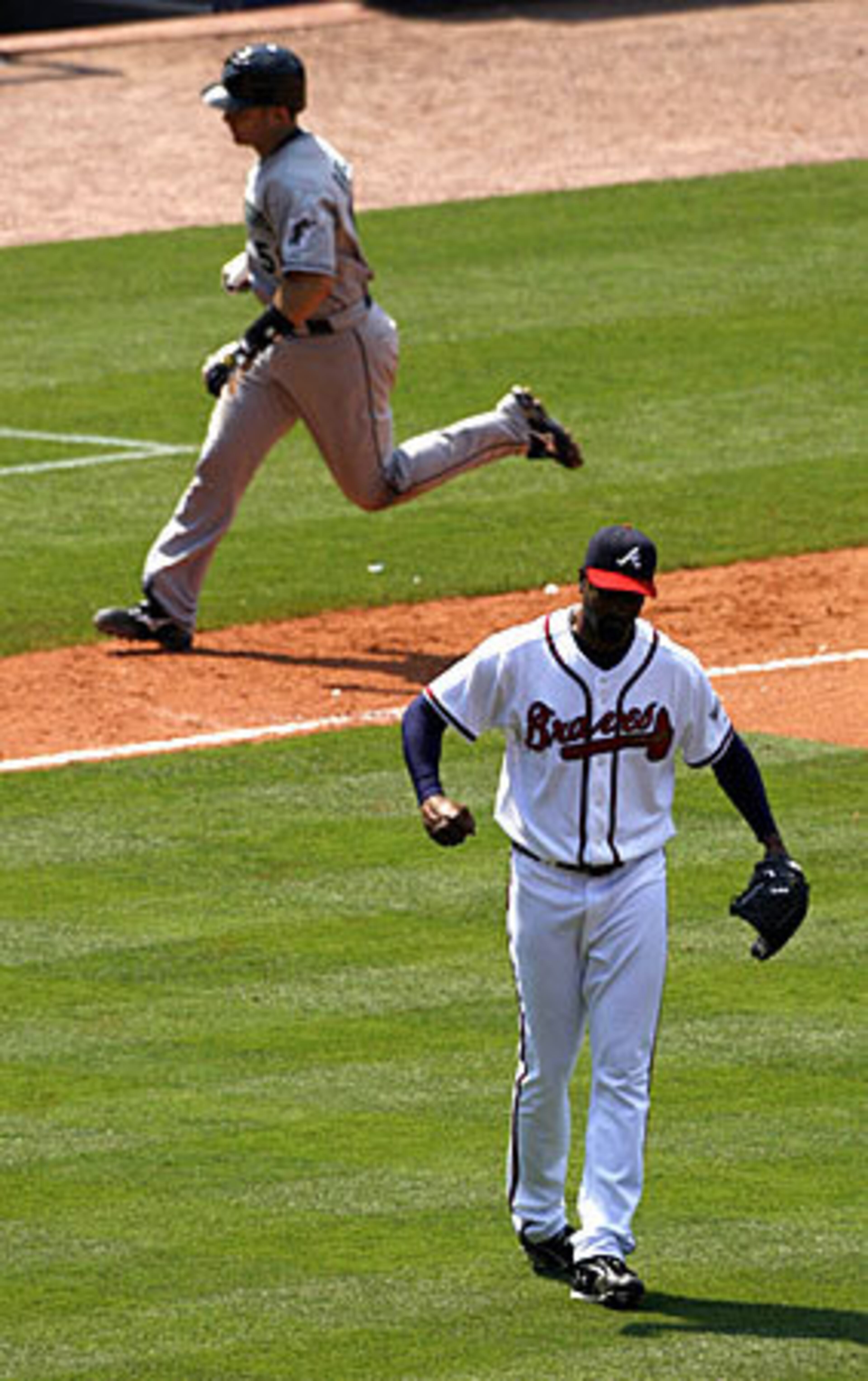 It was a rough day for Braves' reliever Manny Acosta, who surrended a tying two-run home run to Florida's Mike Rabelo (back) in the ninth inning. Things would get worse for Acosta.