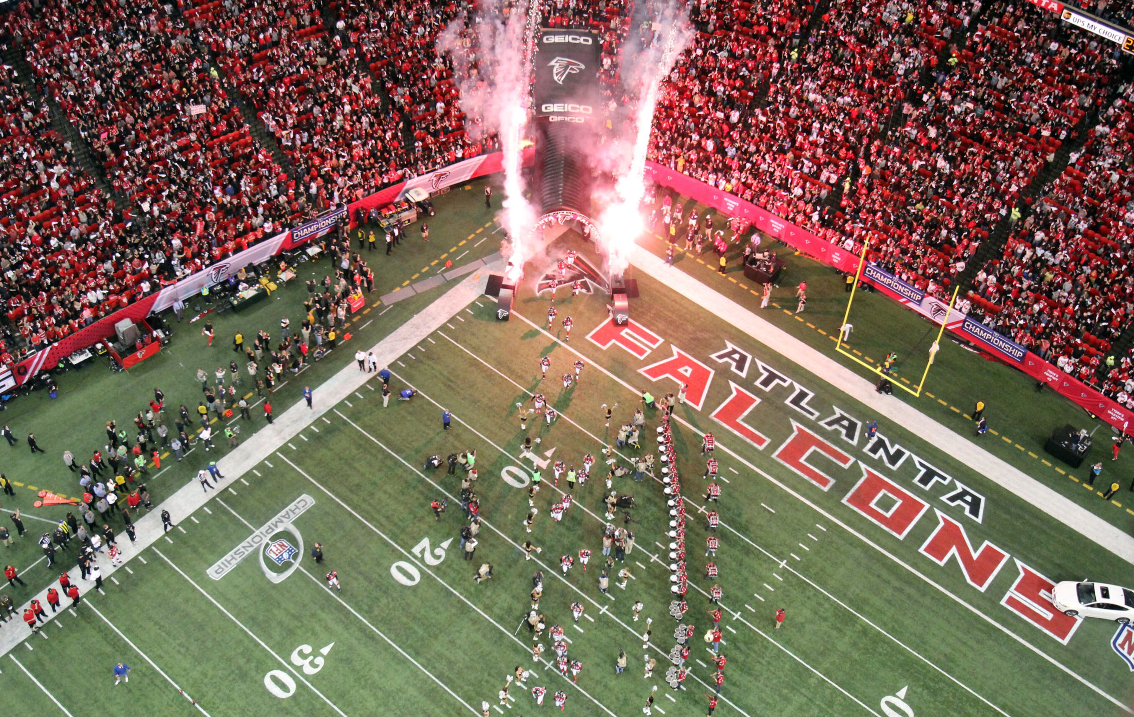 Atlanta Falcons players run out of the tunnel before their game against the San Francisco 49ers in the NFC Championship game at the Georgia Dome Sunday afternoon in Atlanta, Ga., January 20, 2013. JASON GETZ / JGETZ@AJC.COM