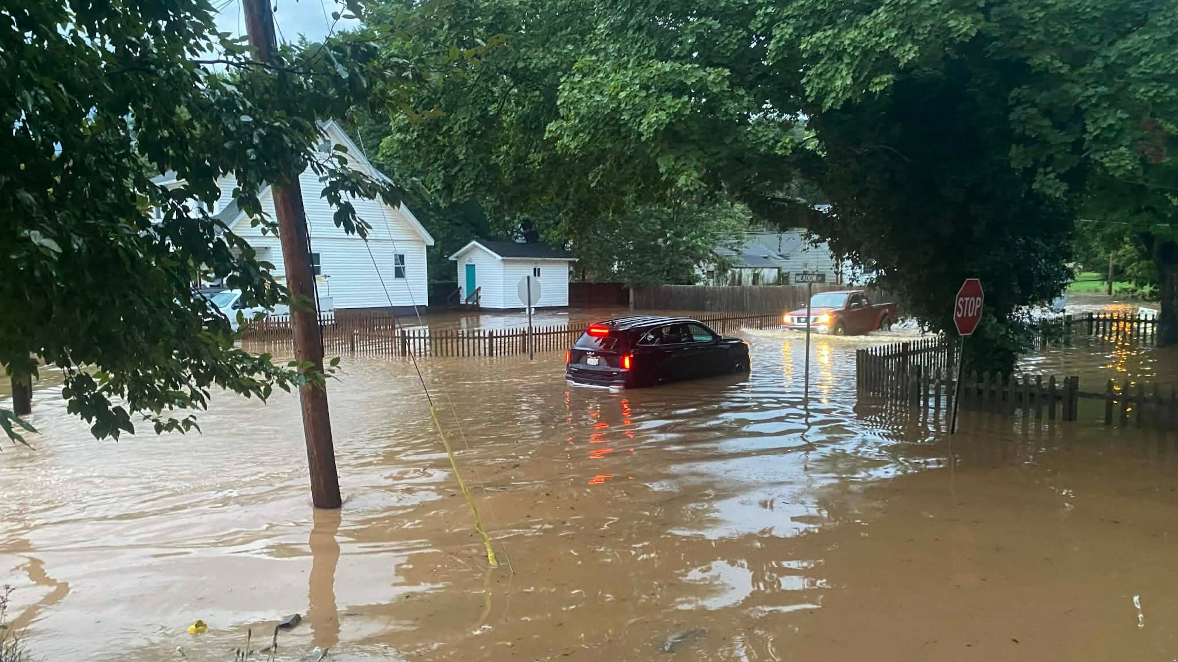 This photo provided by Joe Kinzer shows flash flooding Tuesday, July 21, 2026, in Buckhannon, W.Va. (Joe Kinzer via AP)