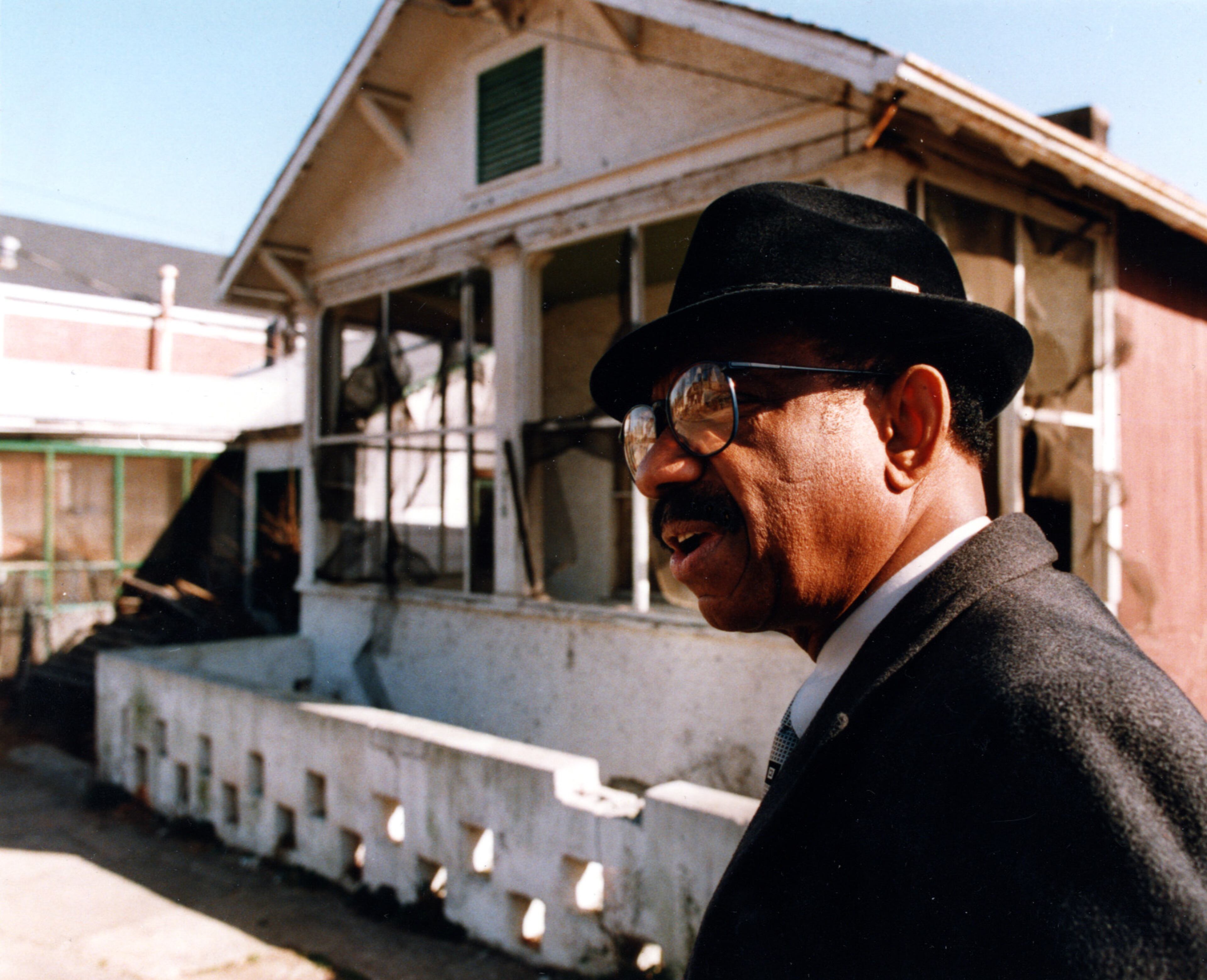 Developer Herman Russell gets emotional as he tours his childhood home in the Summerhill neighborhood, upset at the state of the house. He hoped that the Olympics will be a boon to the now-blighted neighborhood. Photo taken January 27, 1993. AJC FILE