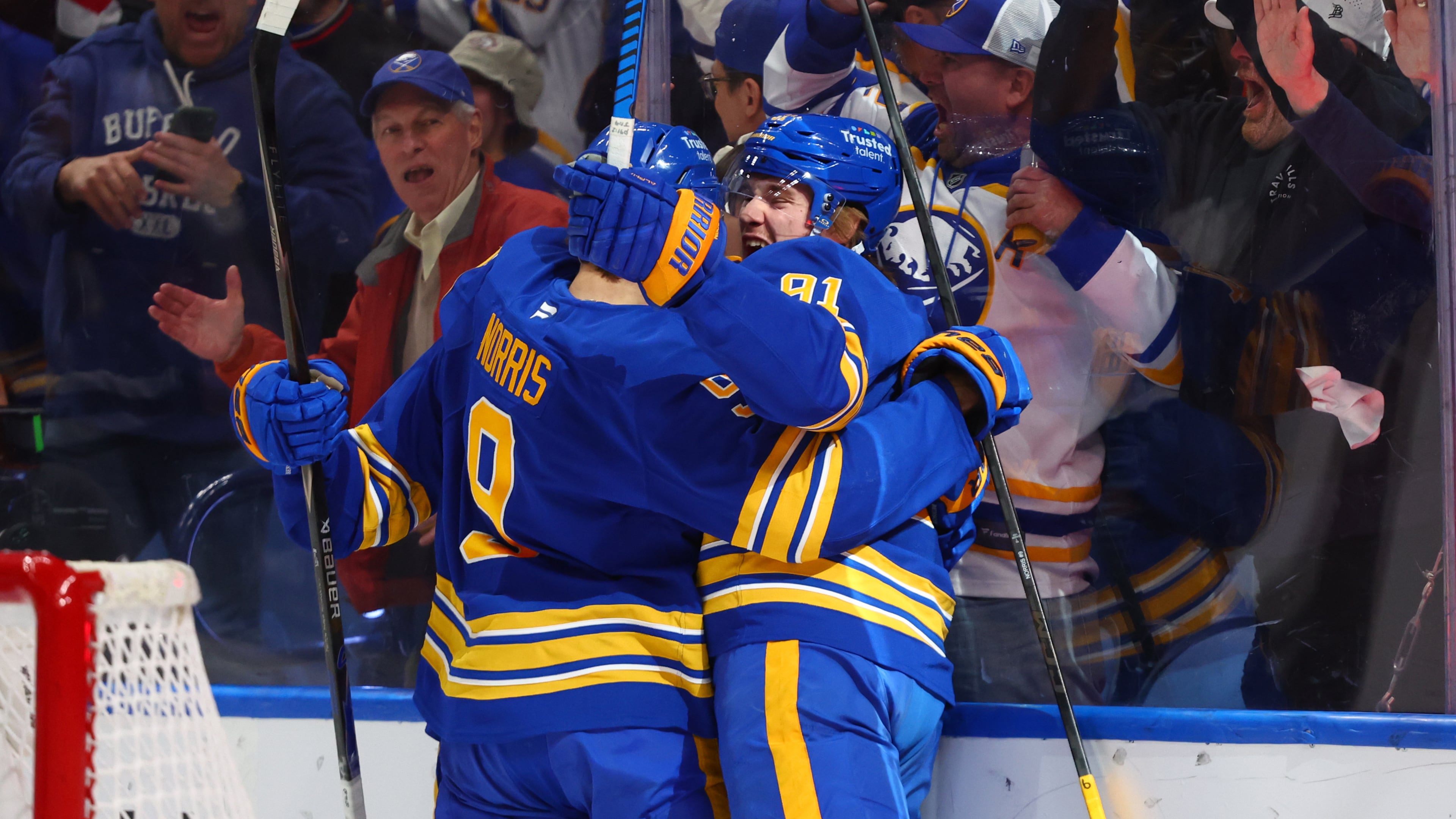 Buffalo Sabres right wing Josh Doan, right, celebrates his goal with center Josh Norris, during the first period in Game 1 of a second-round NHL hockey Stanley Cup playoff series, Wednesday, May 6, 2026, in Buffalo, N.Y. (AP Photo/Jeffrey T. Barnes)