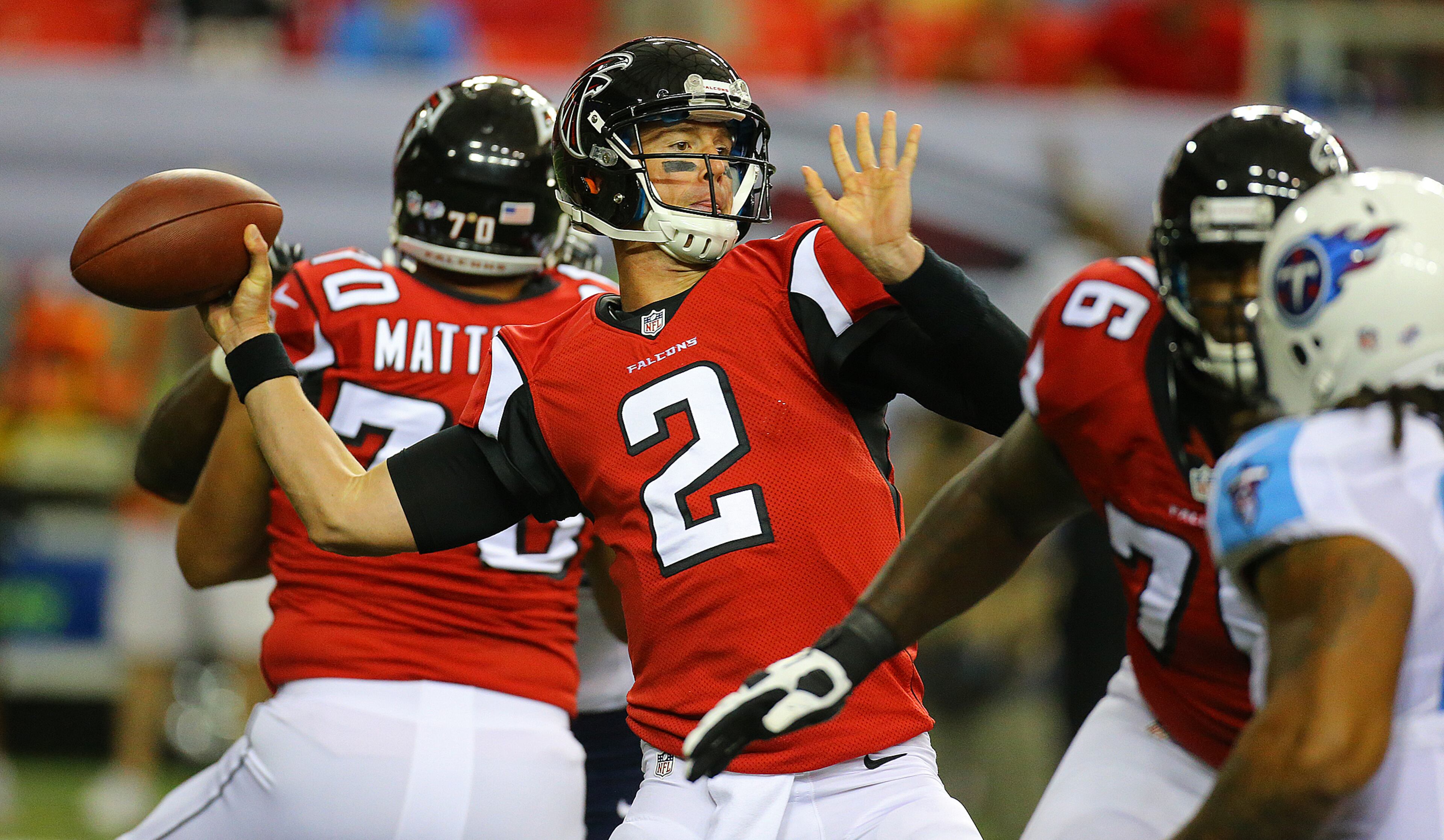 Falcons quarterback Matt Ryan makes a long pass against the Titans during the first half in their NFL exhibition game on Sunday, August 23, 2014, in Atlanta.