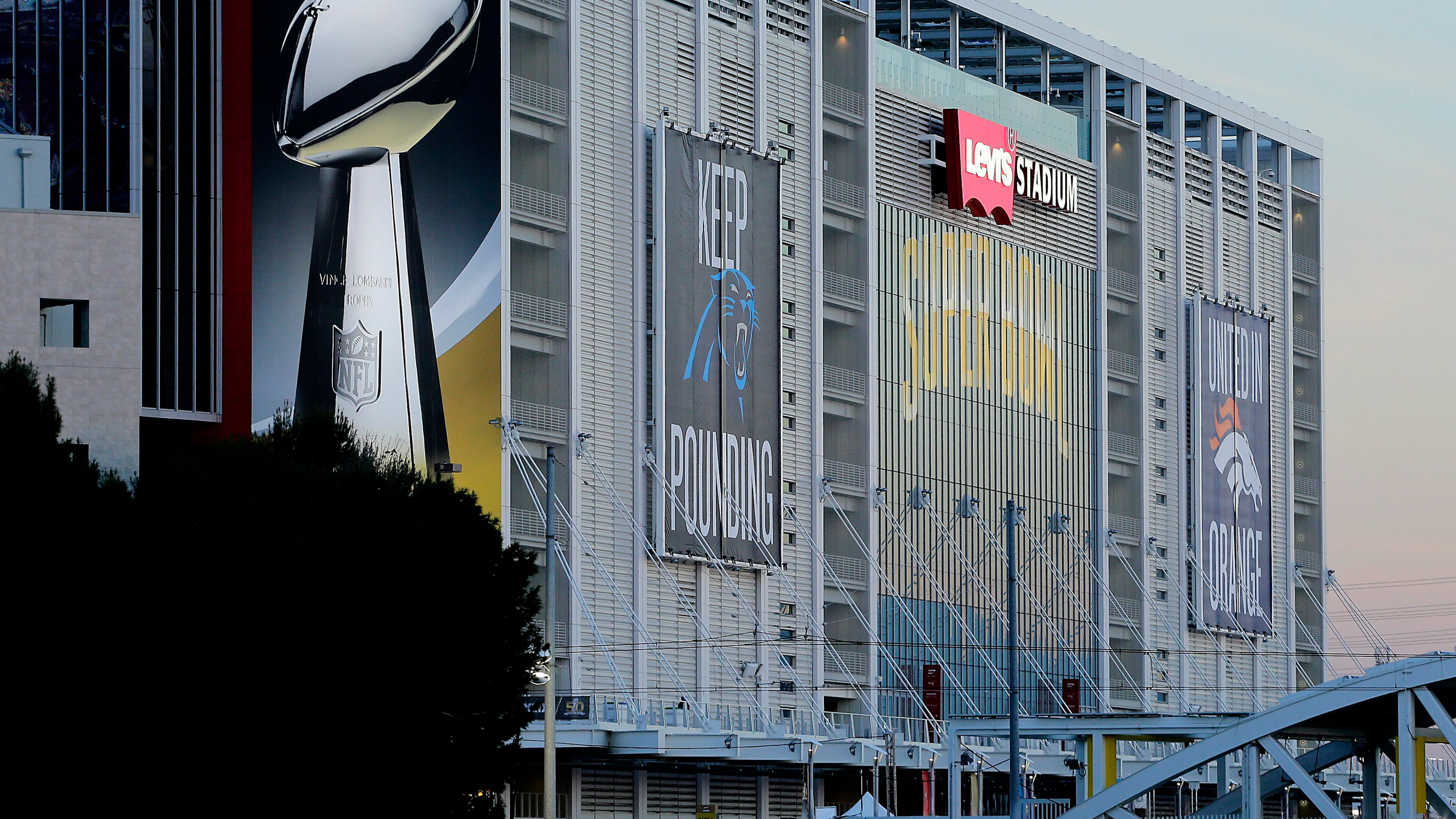 A plane flies over Levi's Stadium in advance of Sunday's NFL Super Bowl 50 football game in Santa Clara, Calif. (AP Photo/Charlie Riedel)