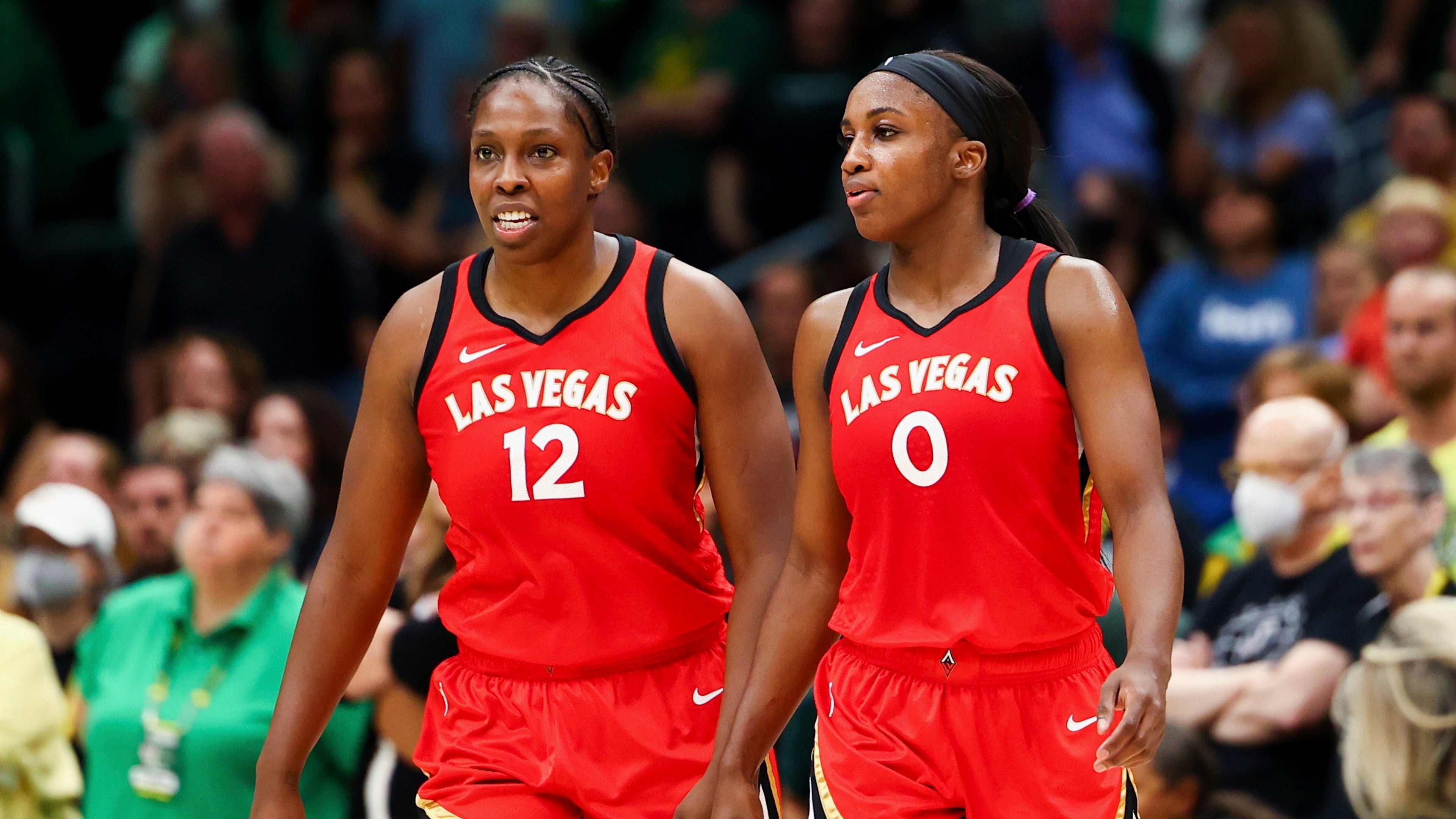 FILE - Las Vegas Aces guard Chelsea Gray (12) and guard Jackie Young (0) look on during the second half of Game 4 of a WNBA basketball playoff semifinal against the Seattle Storm, Tuesday, Sept. 6, 2022, in Seattle. (AP Photo/Lindsey Wasson, File)