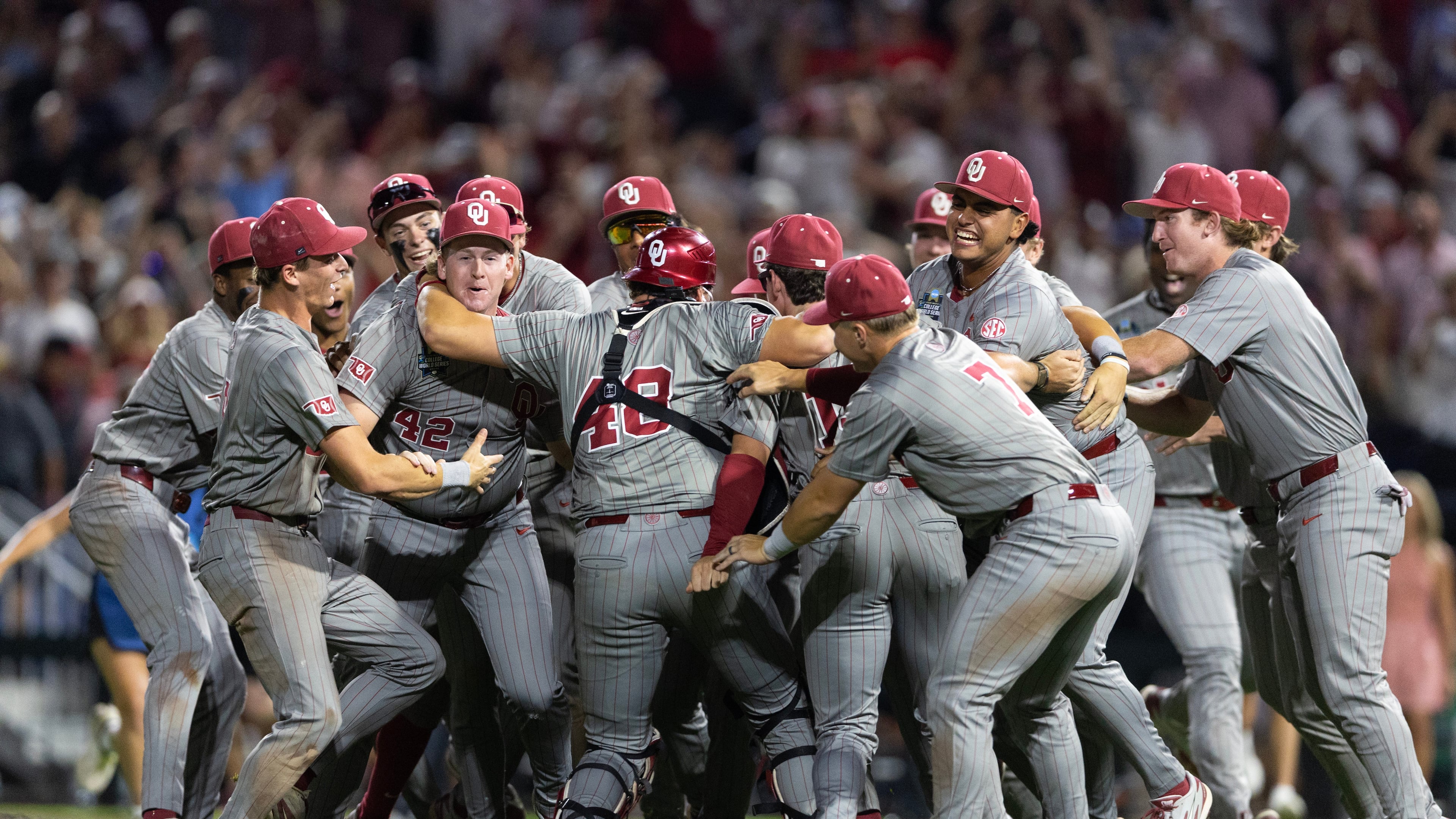 Oklahoma players celebrate after defeating North Carolina in Game 3 of the NCAA College World Series baseball finals in Omaha, Neb., Monday, June 22, 2026. (AP Photo/Rebecca S. Gratz)
