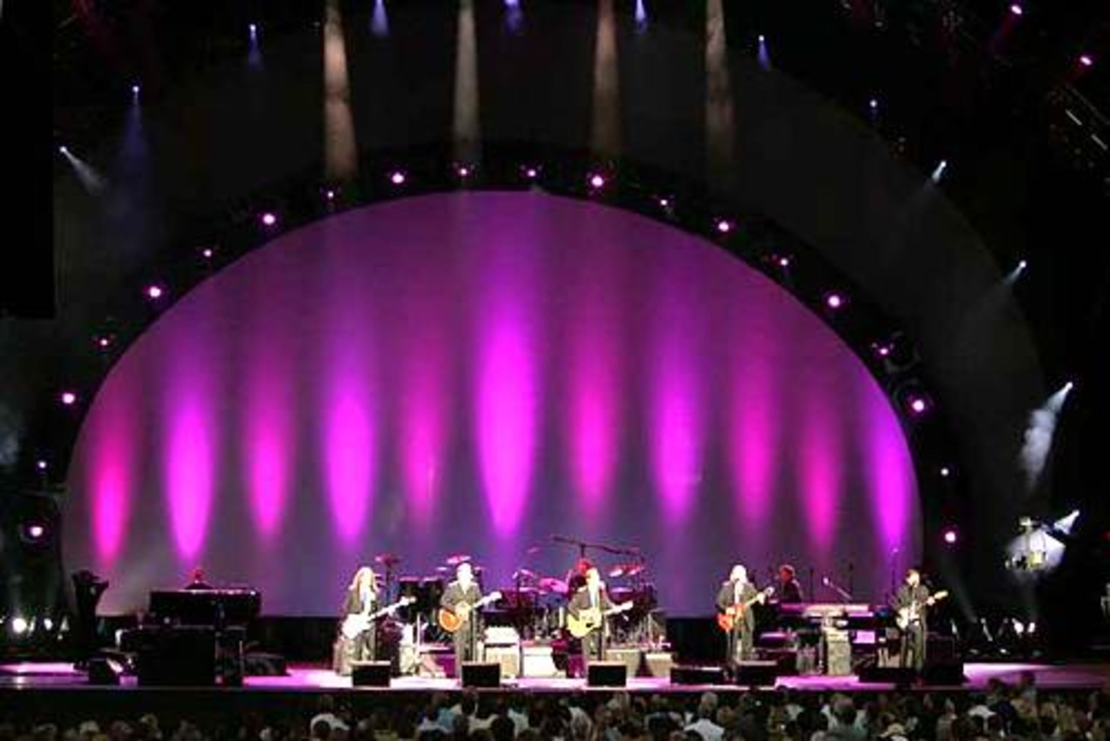 The Eagles initiated the Verizon Wireless Amphitheatre at Encore Park as a rock venue on Wednesday night. The new amphitheatre in Alpharetta had its grand opening last Saturday with a performance by the Atlanta Symphony Orchestra, which owns and operates the facility.