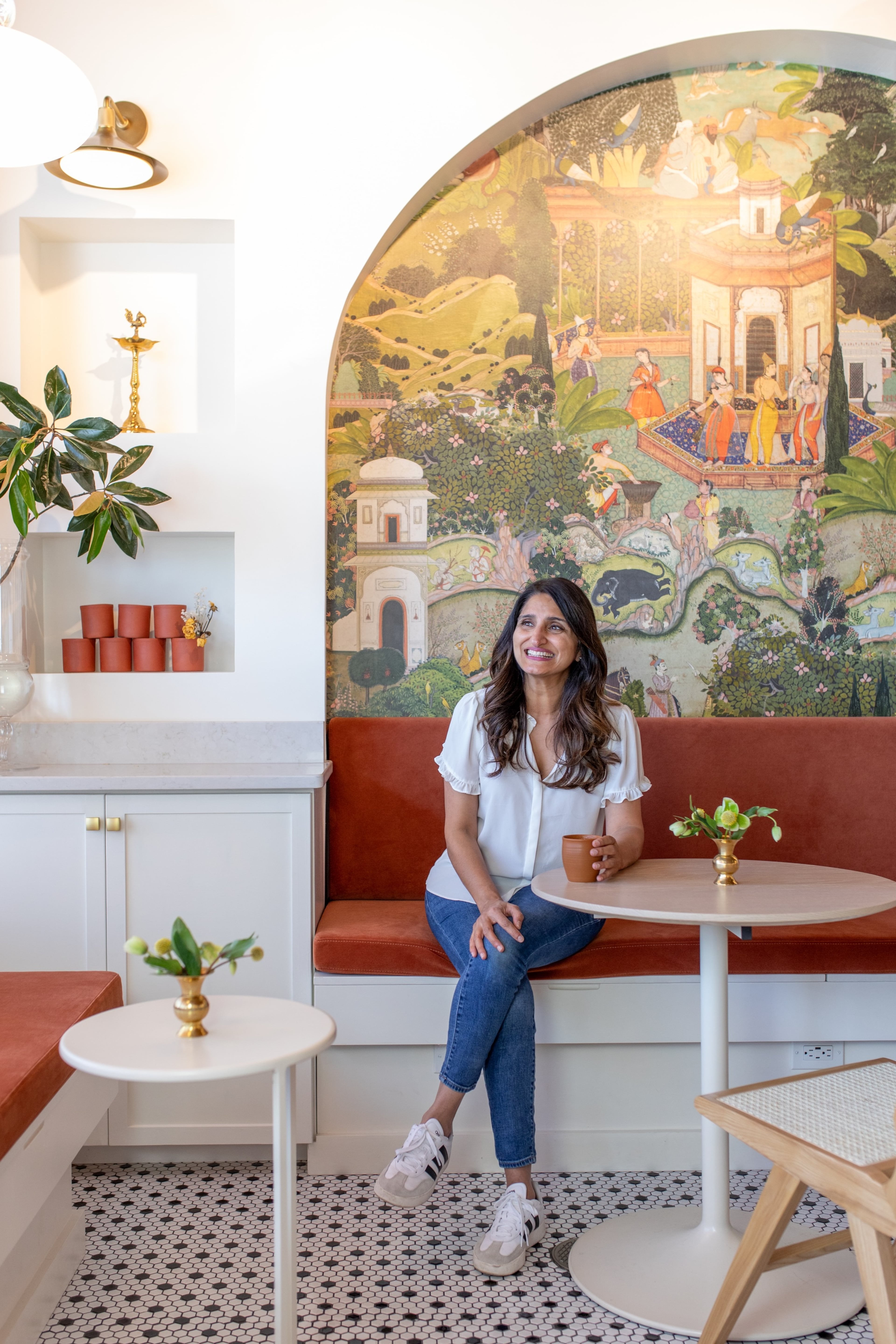 Monica Sunny sits inside her tea shop, the Chai Box Cafe. “I wanted this cafe to feel like an extension of my home,” Sunny says. (Courtesy of the Chai Box Cafe)