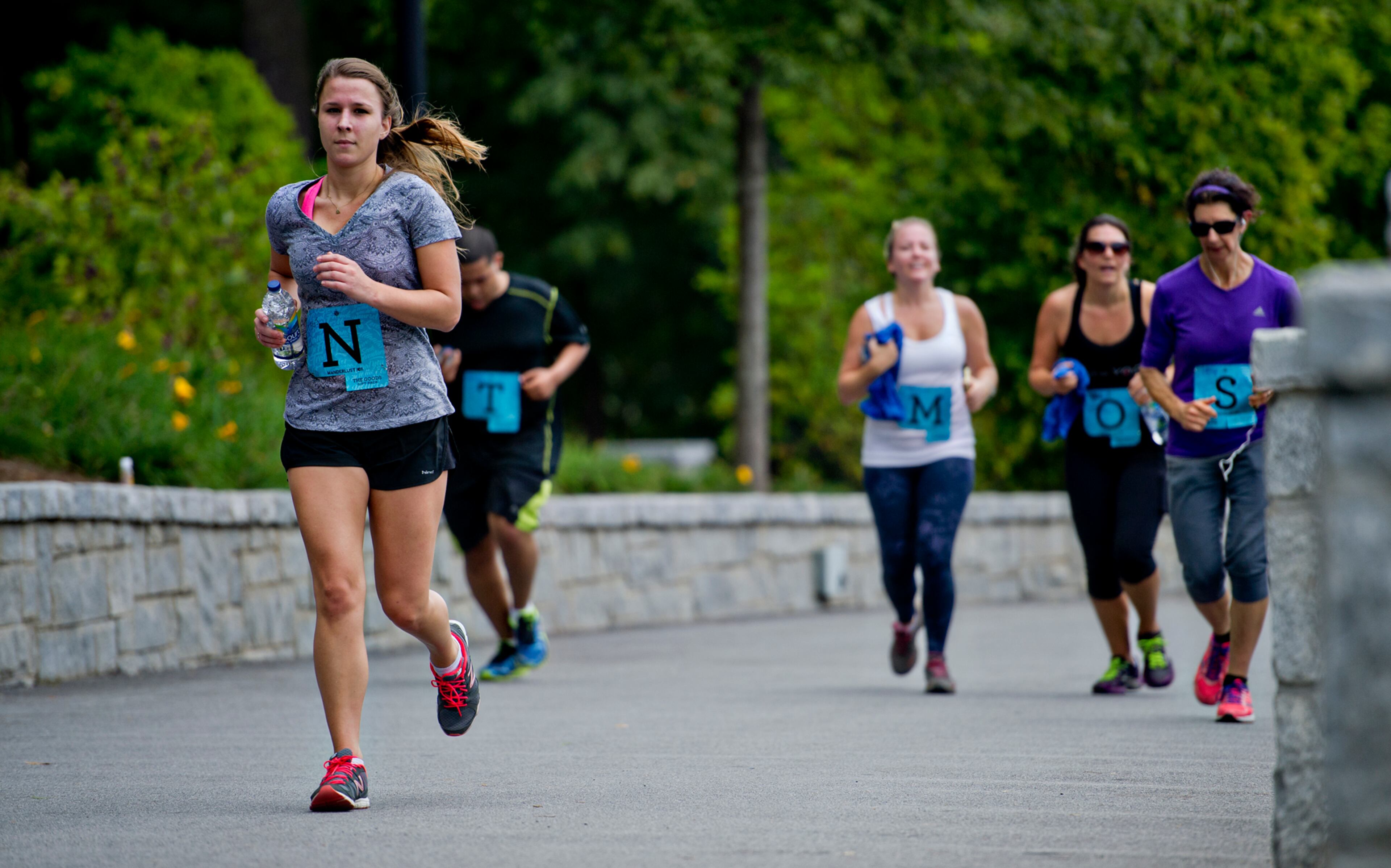 Hayley Thacher (left) runs towardsthe finish line during the 5k portion of Wanderlust 108 at Piedmont Park in Atlanta on Sunday, Sept. 28, 2014. JONATHAN PHILLIPS / SPECIAL