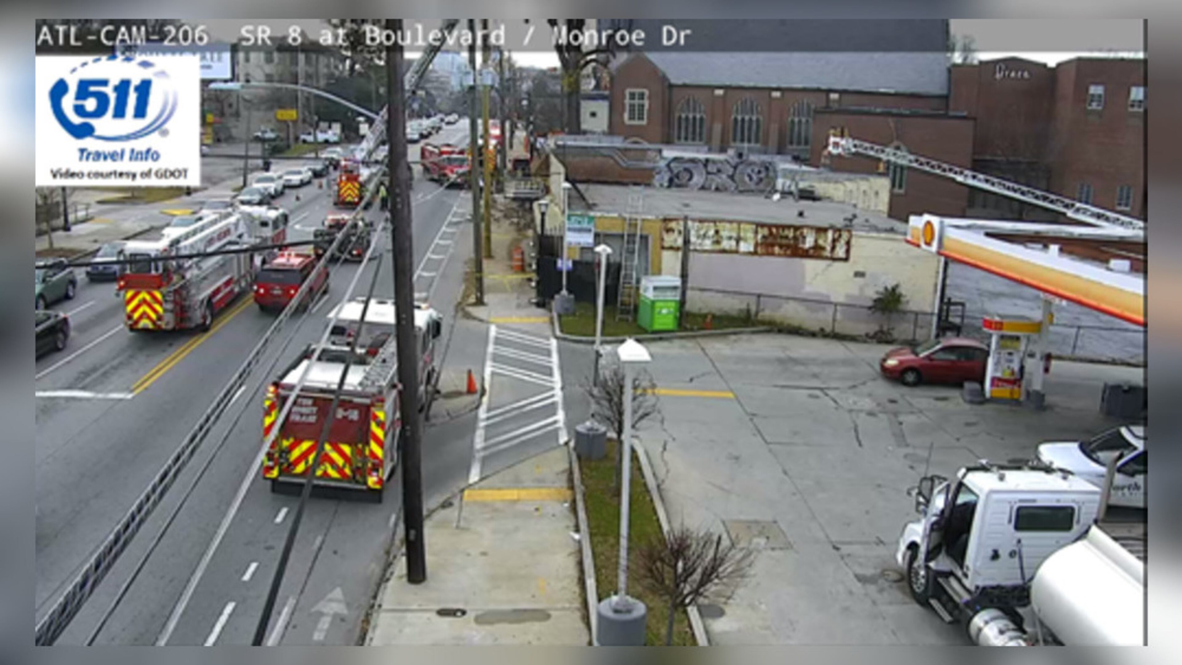 Atlanta fire officials are investigating what led a car to crash into a building in Midtown.