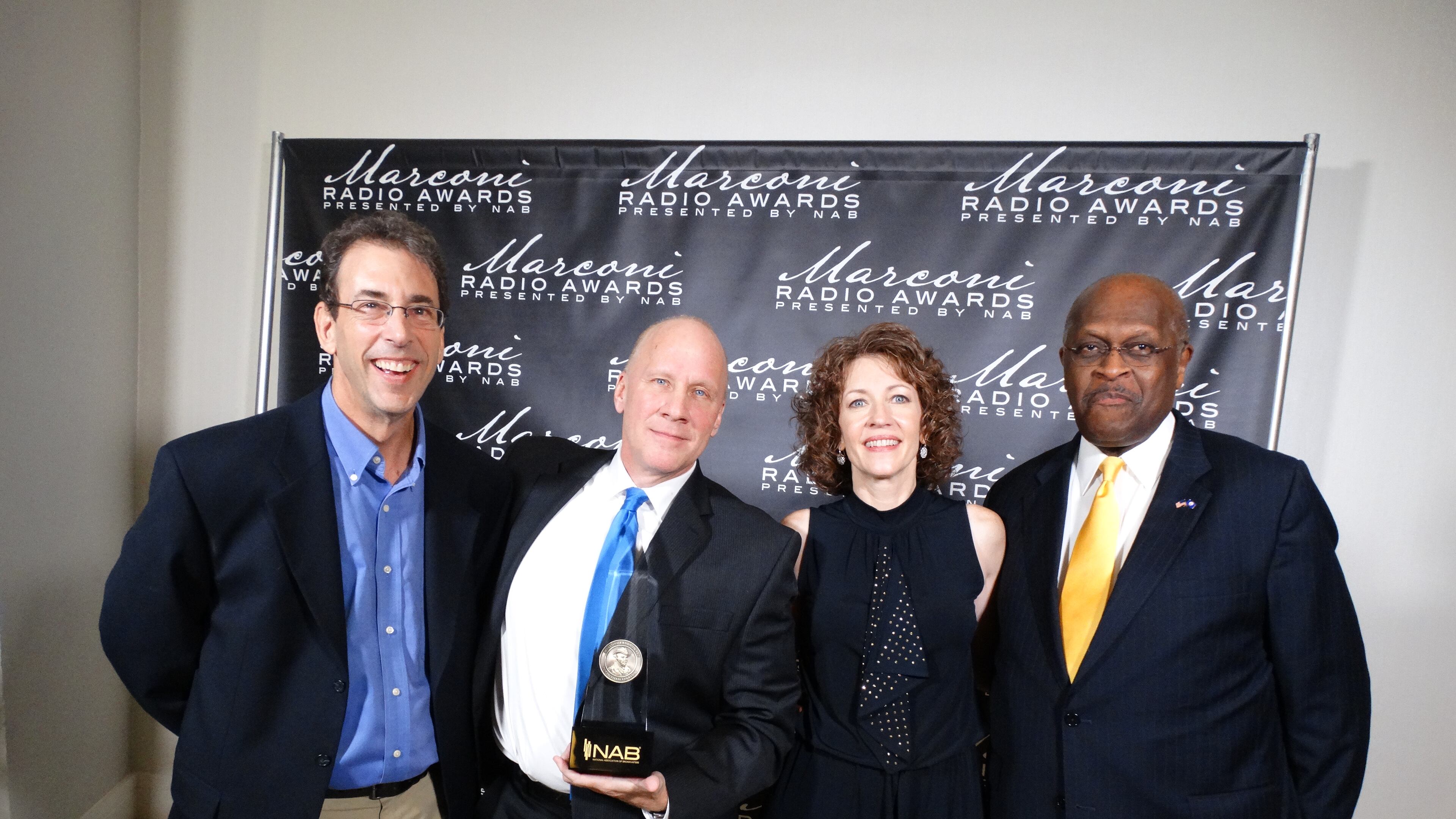 Talk show host Clark Howard, PD Pete Combs, Cox Media Group radio general manager Donna Hall and talk show host Herman Cain after WSB won its Marconi Award for best news/talk station. CREDIT: Rodney Ho/rho@ajc.com