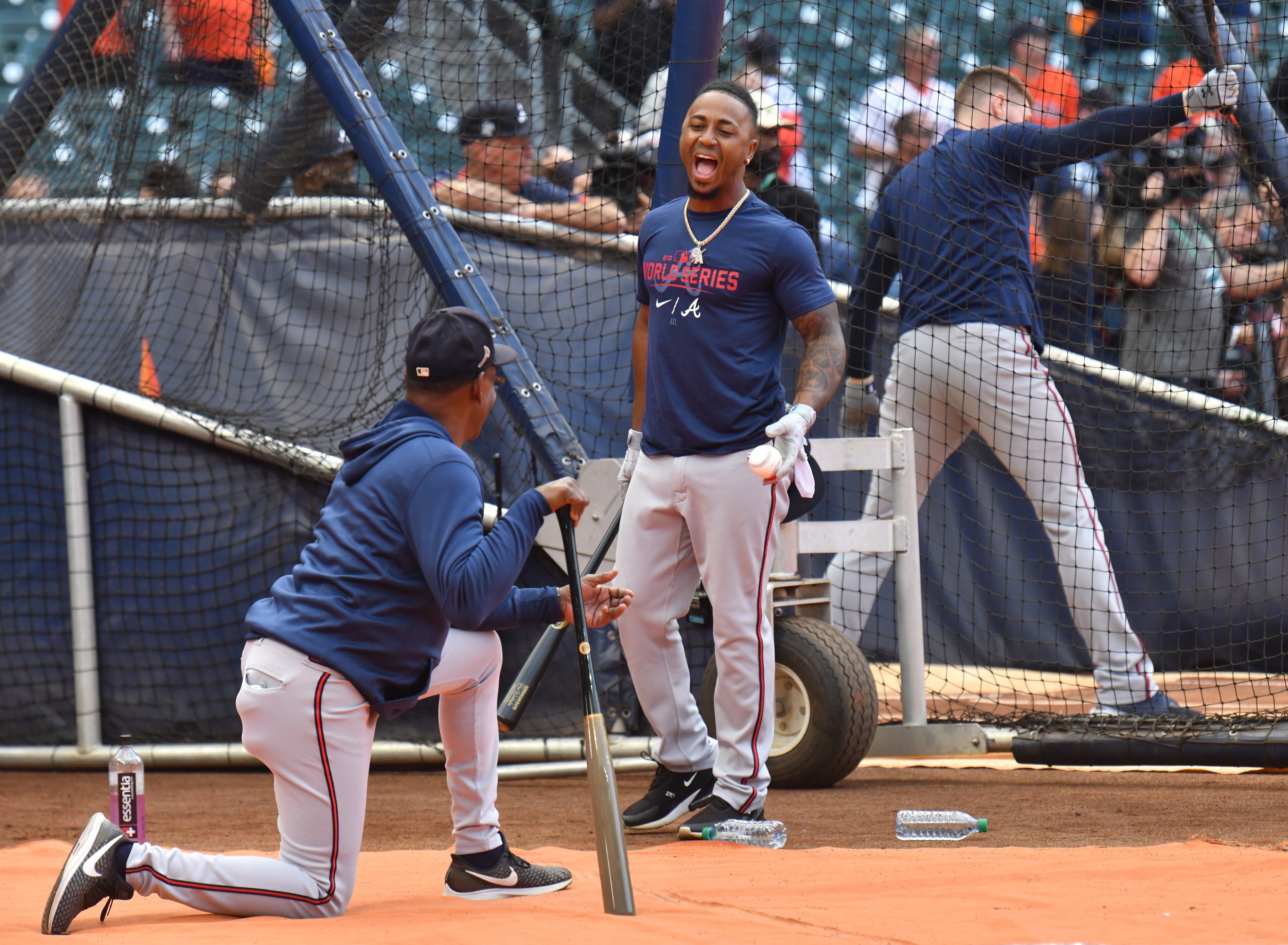 Braves second baseman Ozzie Albies smiles as he talks to third base coach Ron Washington prior to Game 6 of baseball's World Series. (Hyosub Shin / Hyosub.Shin@ajc.com)
