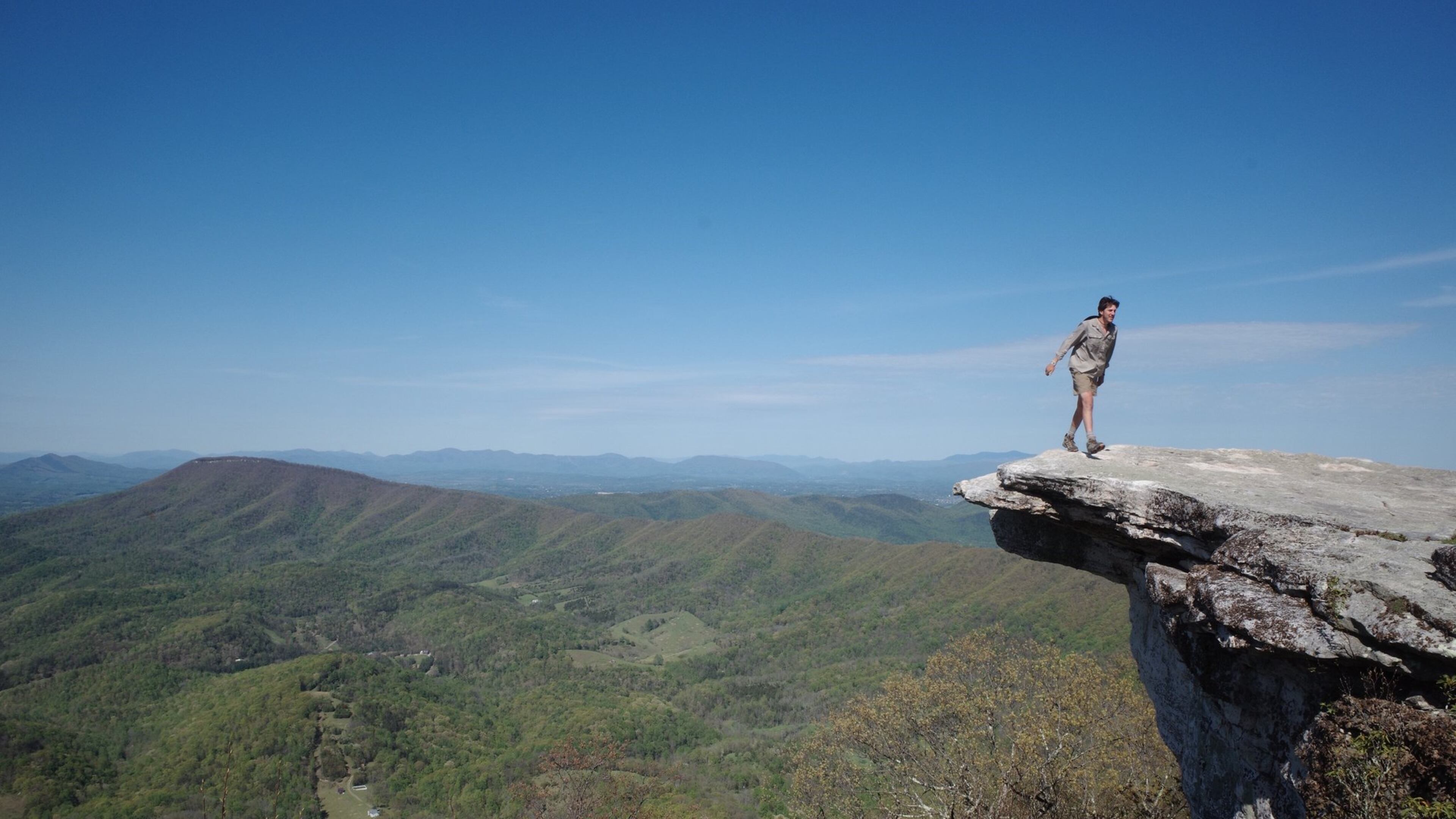 Though the Appalachian Trail Conservancy has asked all through-hikers to leave the trail, a small group has continued their journey, on foot, from Georgia to Maine. Here Henry Wilber, 22, of Atlanta, steps back from the edge of McAfee Knob in Virginia. CONTRIBUTED BY HENRY WILBER