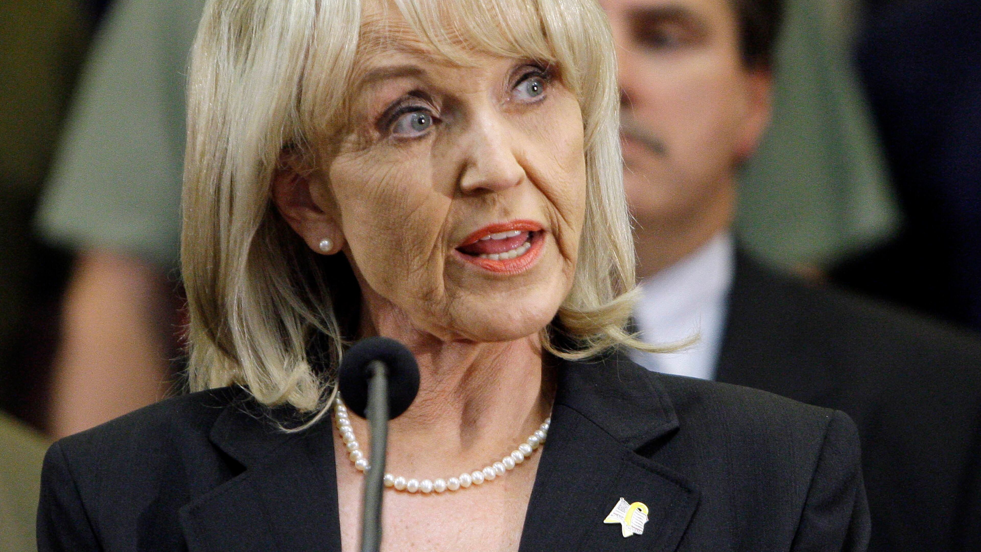 Arizona Gov. Jan Brewer speaks during a news conference after signing immigration bill SB1070 into law Friday, April 23, 2010, in Phoenix. The sweeping measure would make it a crime under state law to be in the country illegally, and would require local law enforcement to question people about their immigration status if there is reason to suspect they are in the country illegally. (AP Photo/Ross D. Franklin)