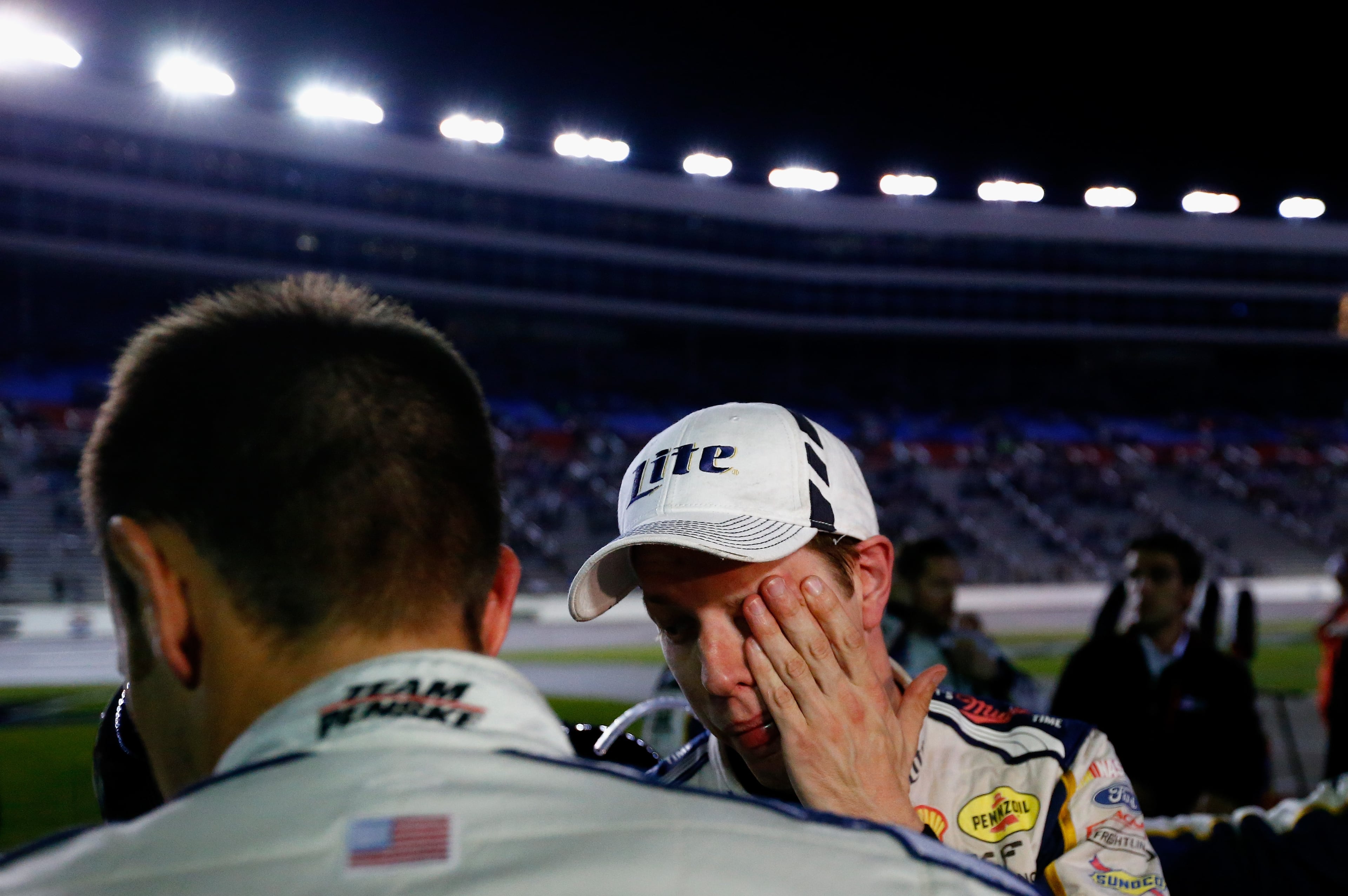FORT WORTH, TX - NOVEMBER 02: Brad Keselowski, driver of the #2 Miller Lite Ford, reacts after a fight involving Jeff Gordon, driver of the #24 Drive To End Hunger Chevrolet, during the NASCAR Sprint Cup Series AAA Texas 500 at Texas Motor Speedway on November 2, 2014 in Fort Worth, Texas. (Photo by Jonathan Ferrey/Getty Images for Texas Motor Speedway)