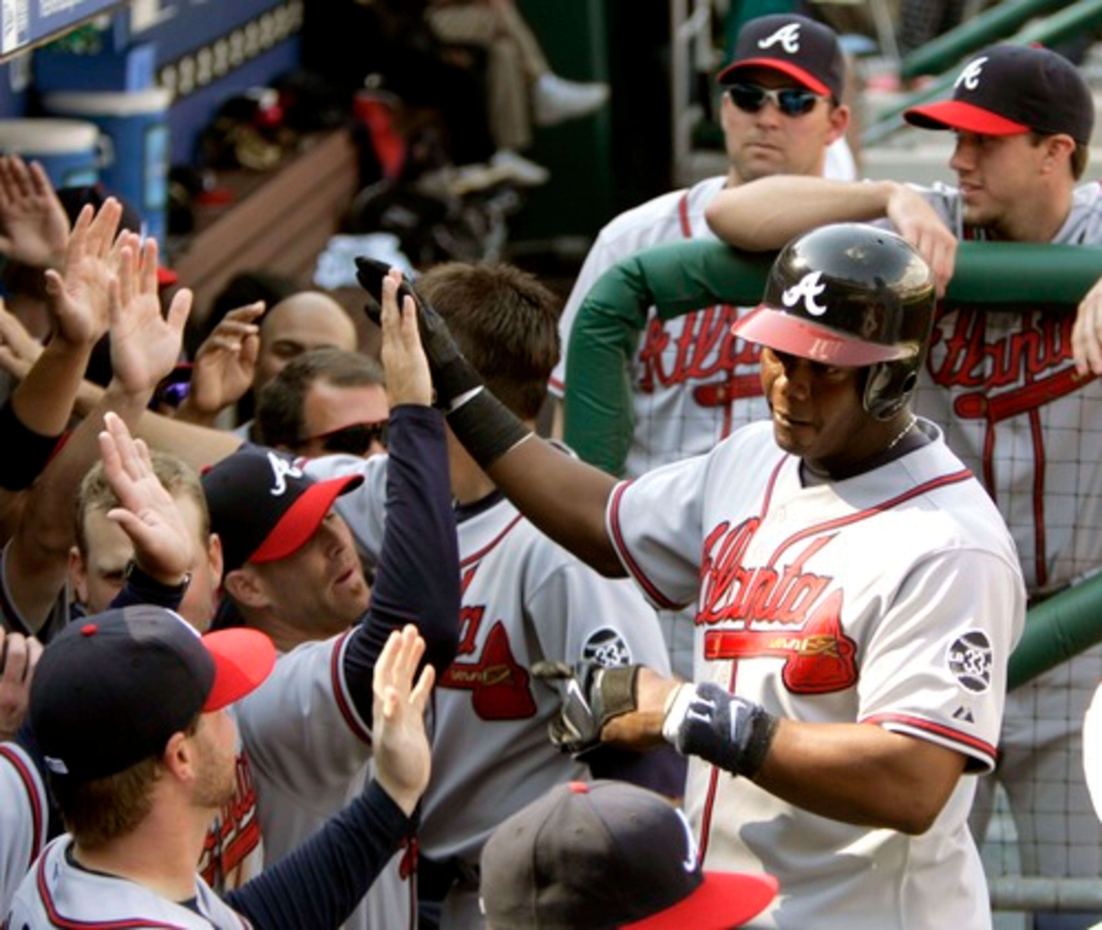 The season began with such promise on April 2 with the Braves defeating the Phillies 5-3 in the season opener at Philadelphia. Edgar Renteria (right) was congratulated in the dugout after hitting a two-run homer. After eight games, the Braves were 7-1.